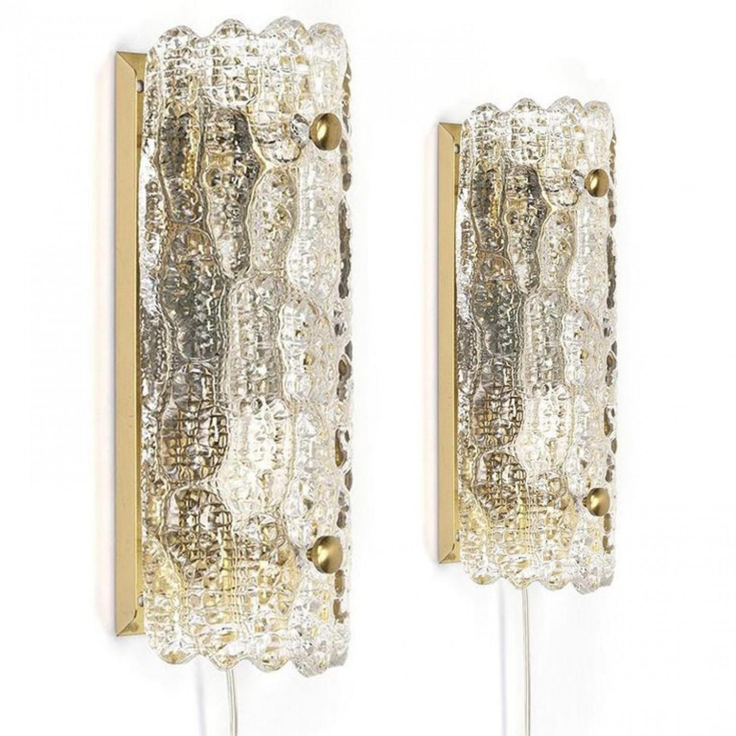 Fantastic pair of mid-century nice textured glass wall lights by Carl Fagerlund for Orrefors.

Height: 11 inches / 28 cm Width: 4.5 inches / 11,5 cm Depth: 2.8 inches / 7 cm Weight: 1,2 kg.
In very good vintage condition. Cleaned well wired and