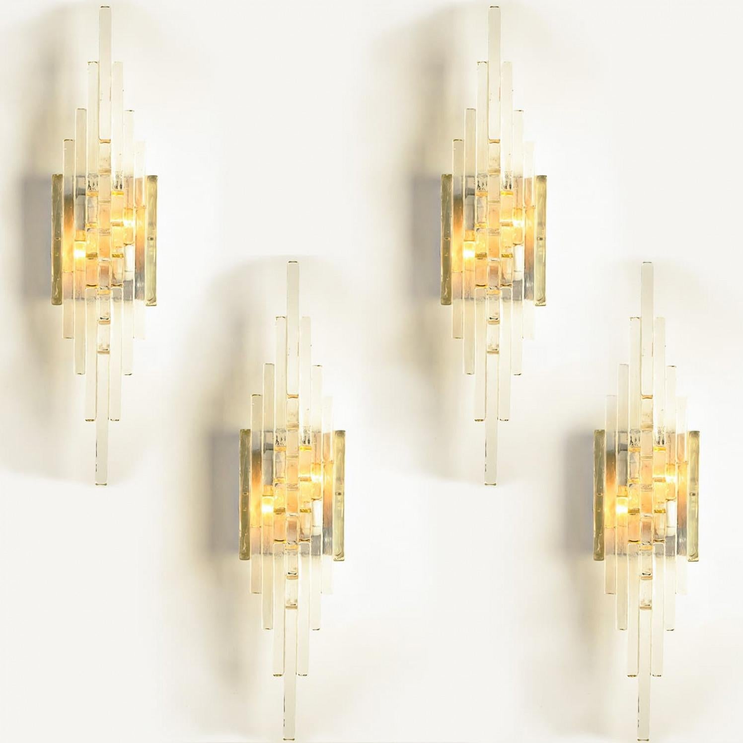 One of the four XXL glass  wall lights. Manufactured by PoliArte, Italy in the 1970s. Albano Poli founded Poliarte in 1968 as an innovative and experimental lighting company.

His typical style was combining stainless steel or raw metal to modular