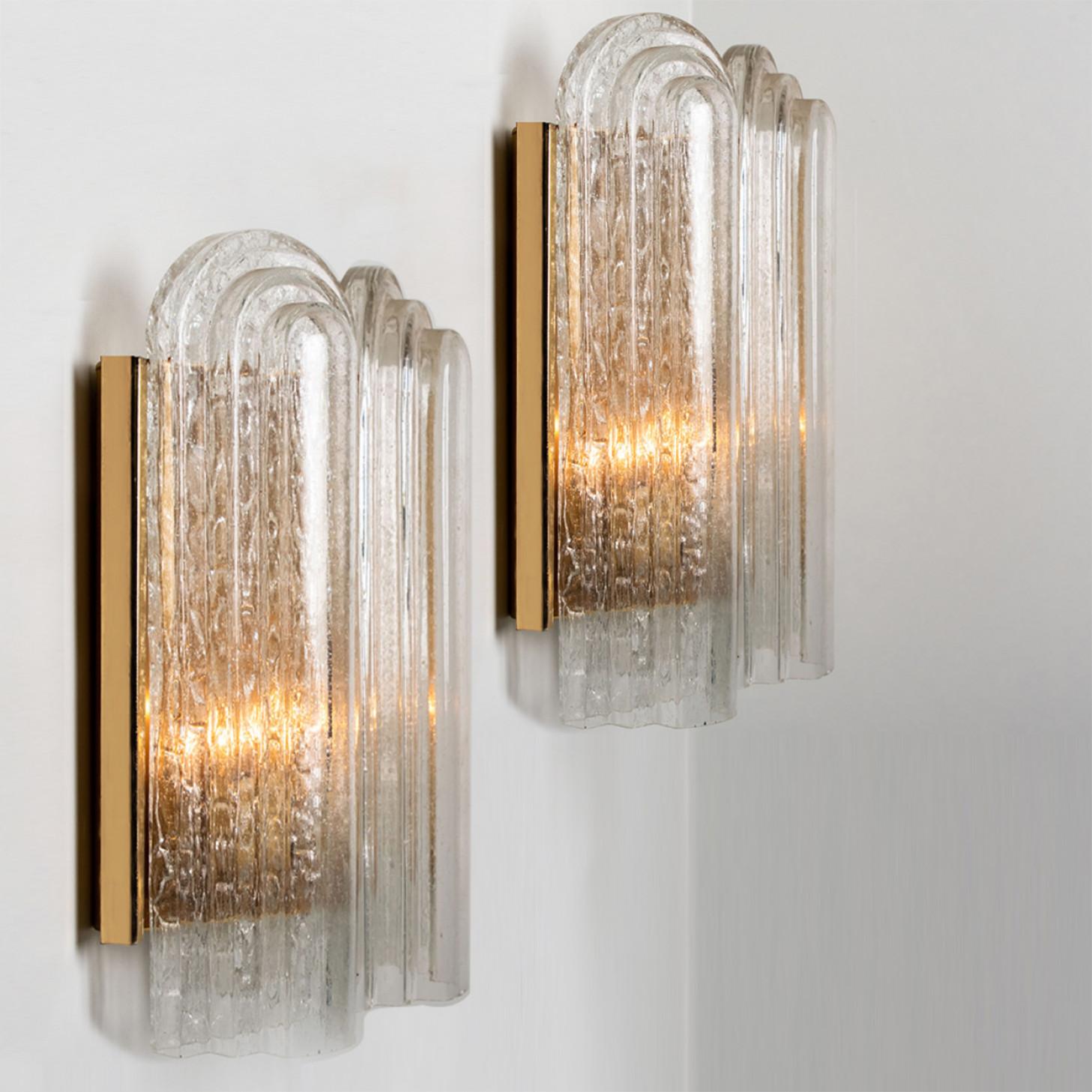 These blown glass wall sconces are designed and manufactured by the iconic firm of Doria Leuchten, Germany in 1960.
They are designed with a brass back plate and art deco style glass shades. High-end pieces.

Dimensions
H 17.72 in (45cm) x W 11.81