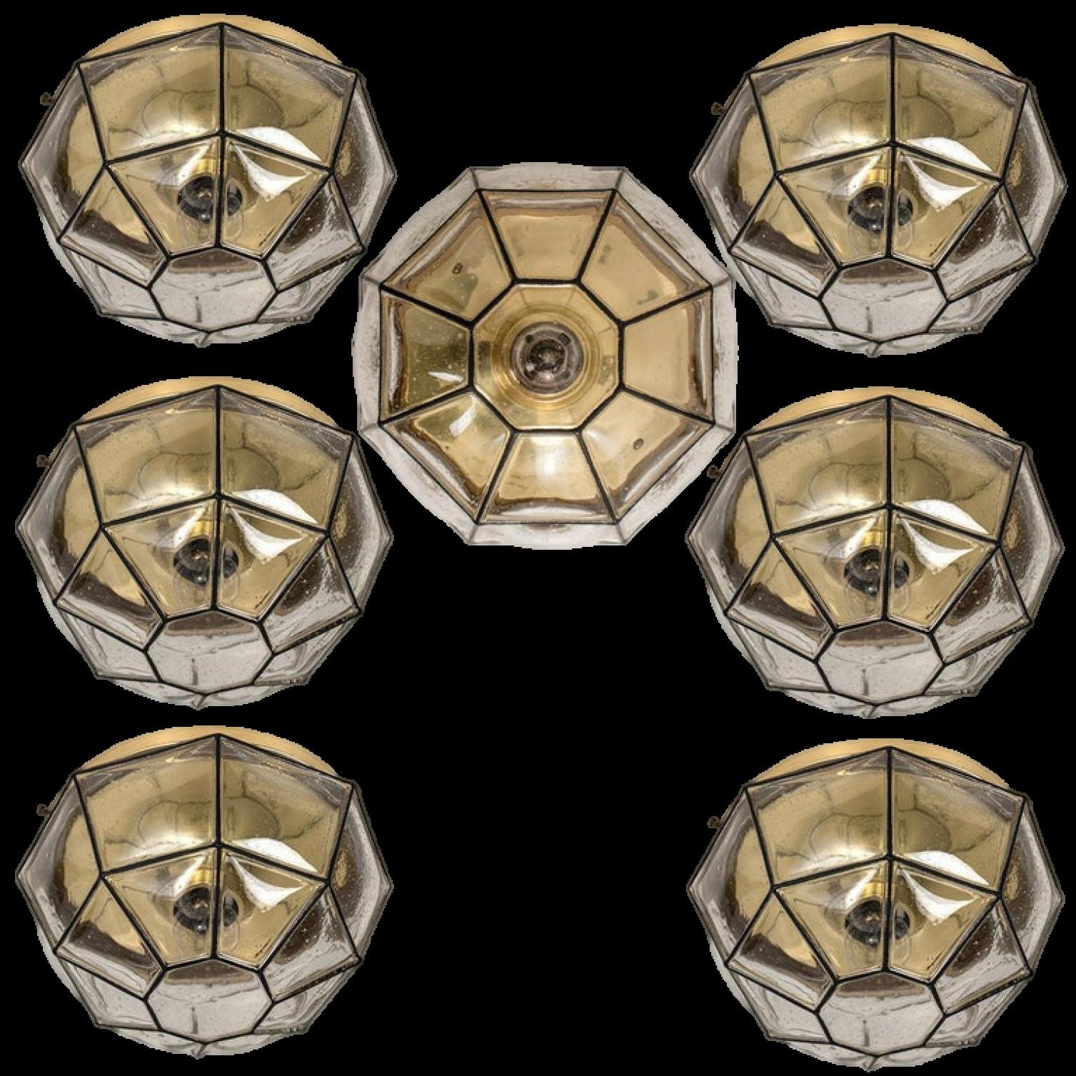 This beautiful and unique octagonal set of glass light flush mounts or wall lights were manufactured by Glashütte Limburg in Germany during the 1960s (late 1960s or early 1970s). Beautiful craftsmanship. Each lamp, made from elaborate clear glass