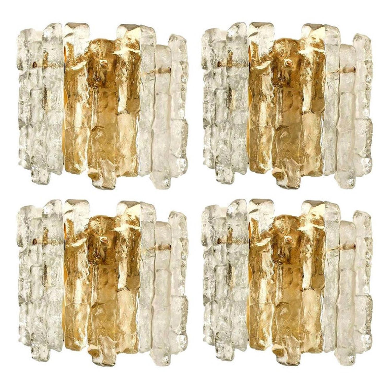 1 of the 6 beautiful and elegant modern brass toned wall lights or sconces, manufactured by J.T. Kalmar Austria in the 1970s. Lovely design, executed to a very high standard.

Each wall light has three solid ice glass sheets dangling on it. Clean