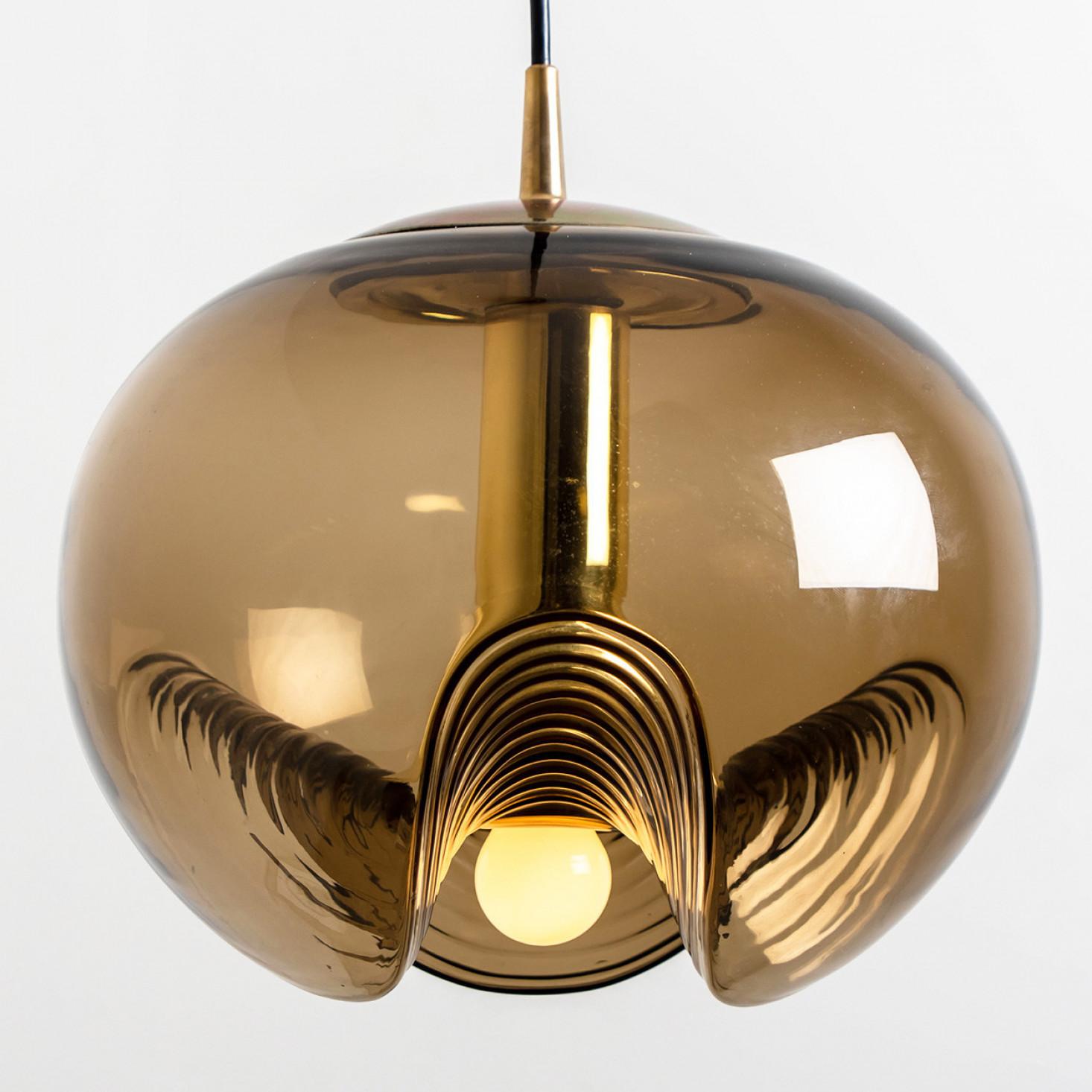 A special set of round biomorphic smoked glass light fixtures designed by Koch & Lowy for Peill & Putzler, manufactured in Germany, circa 1970s. These Peill & Putzler vintage light fixtures become quickly design classics.

The blown glass has a
