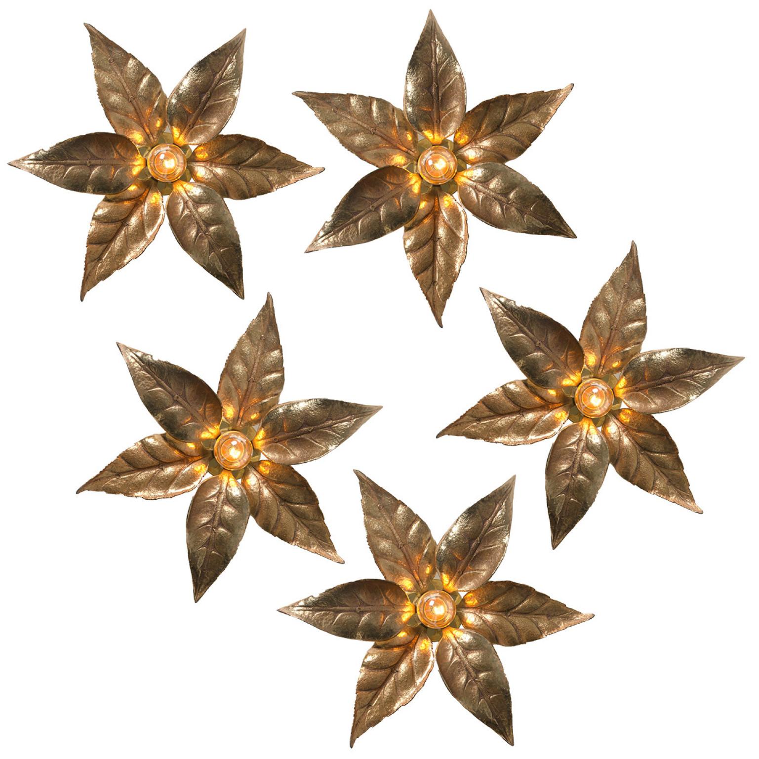 1 of the 6 brass flowers wall lights in the style of designer Willy Daro manufactured by 'Massive Lighting', circa 1970s, Belgium. This decorative and beautiful large sculptural light consists brass-plated flowers on a circular base of the same