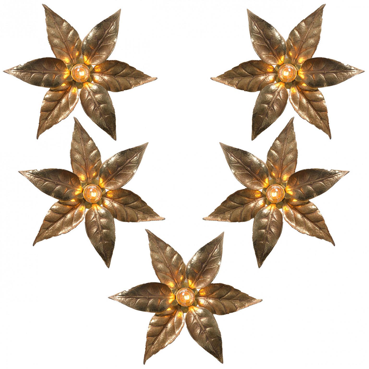 1 of the 6 brass flowers wall lights in the style of designer Willy Daro manufactured by 'Massive Lighting', circa 1970s, Belgium. This decorative and beautiful large sculptural light consists brass-plated flowers on a circular base of the same