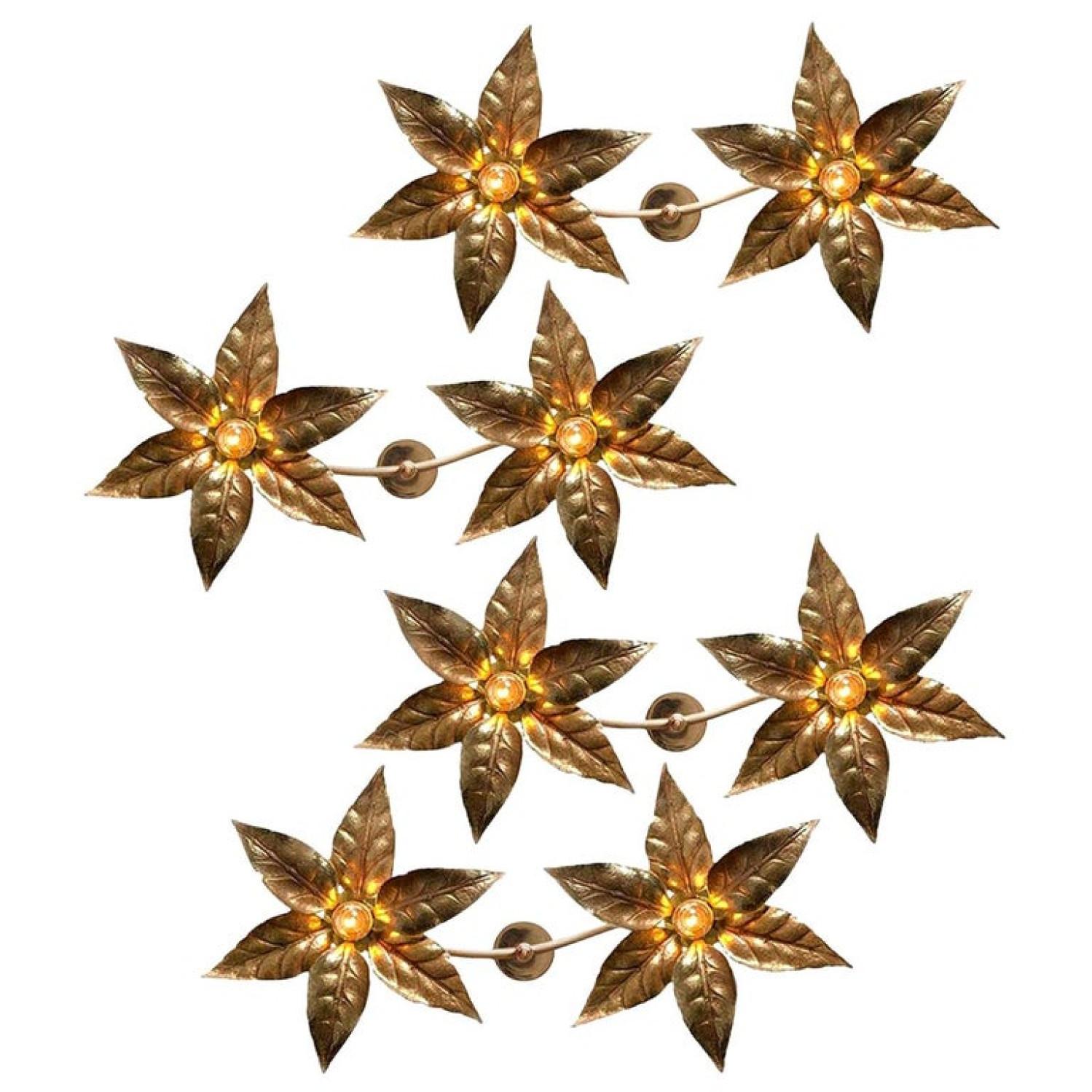 One of the four brass flowers wall sculptures in the style of designer Willy Daro manufactured by 'Massive Lighting', circa 1970s, Belgian. This decorative and beautiful large sculptural light consists of a pair of brass-plated flowers on a bar and
