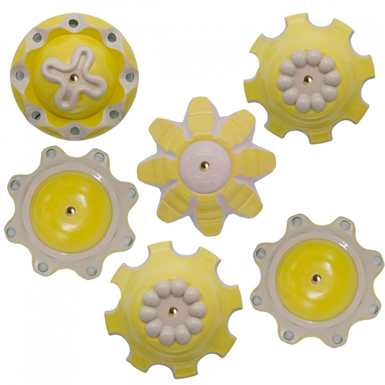 Unique hand-cast ceramic “rosettes” from Jeanine Keizer’s 1990s Lichtpuntje installation are reborn as sculptural pendant lamps. Each set groups five to seven pieces in harmonising colours, creating a gentle, child-friendly glow. The biomorphic