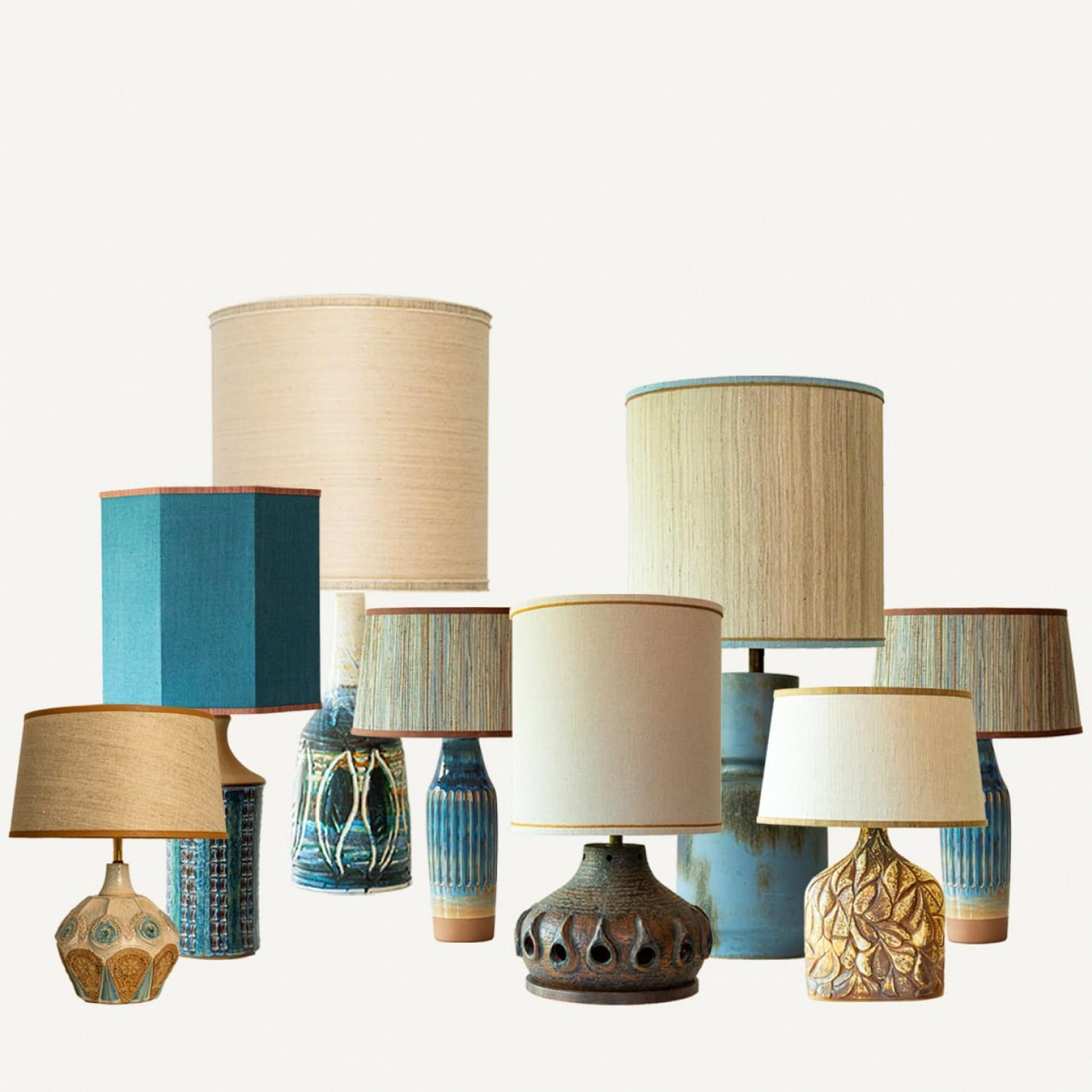 One of the seven ceramic table lamps, 1970s.

This set brings a rich visual appeal to any interior. With its beautiful shapes, it offers a unique presence.

The bases with brown and blue shades fit perfectly with the custom made lamp shades, with