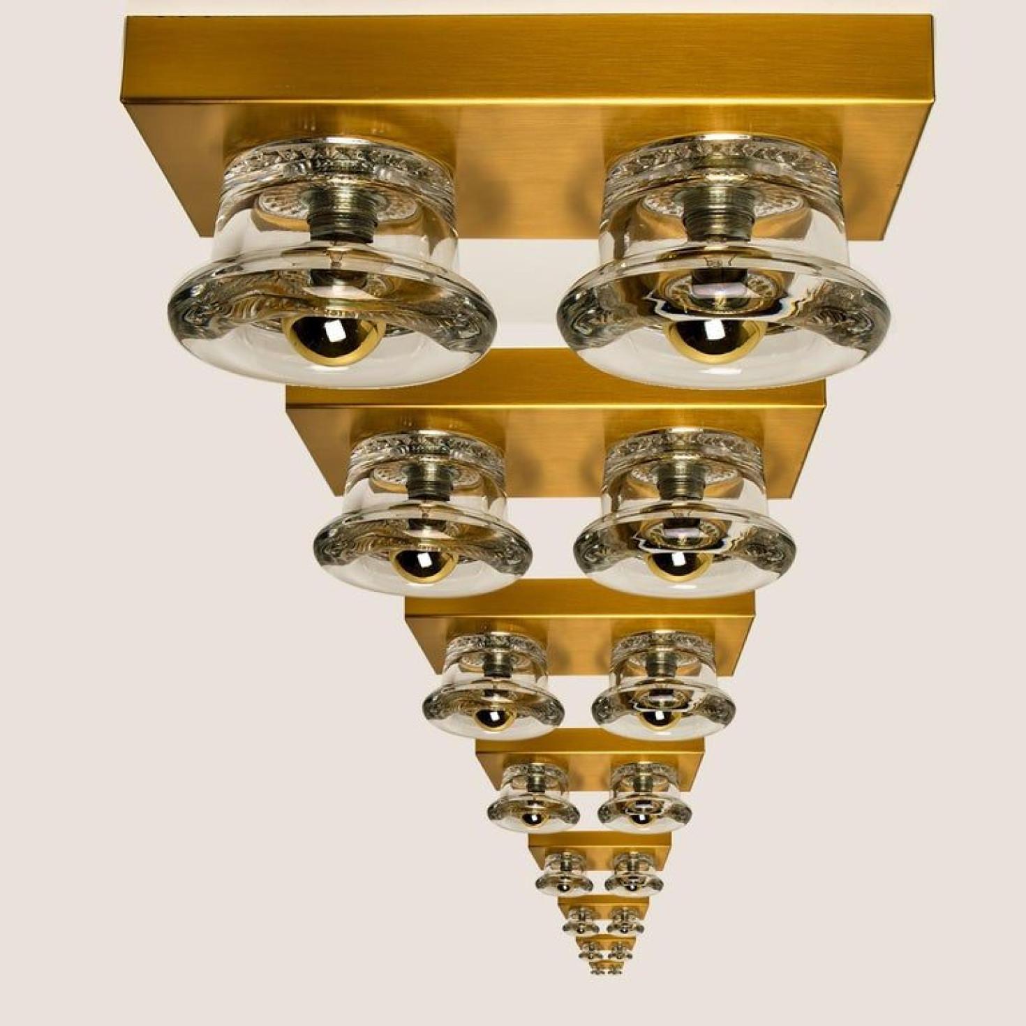 1 of the 8 original glass wall sconces or flush mounts Cosack lights, Germany, 1970s.

Original 1970s modernist wall light with four glass lighting elements. This light was designed and produced by Cosack Lights, one of the premium light producer