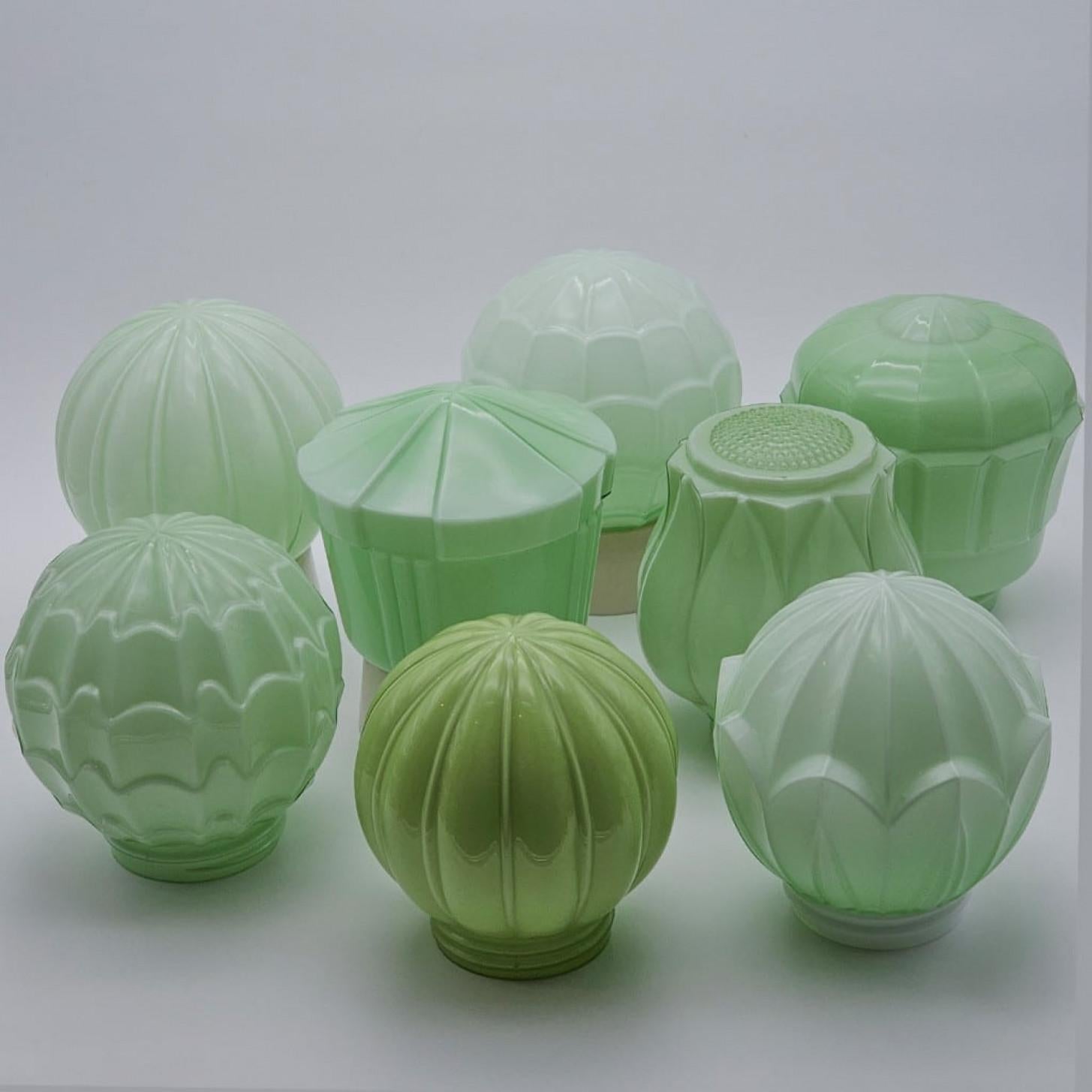 Beautiful pastel green Art Deco Thabur ceiling lamps. Dutch design from 1930. Made by the company Thabur in The Hague, Netherlands. Super cool various pastels with opaline glass and a bakelite fitting/base.

These Thabur lamps can be used as a