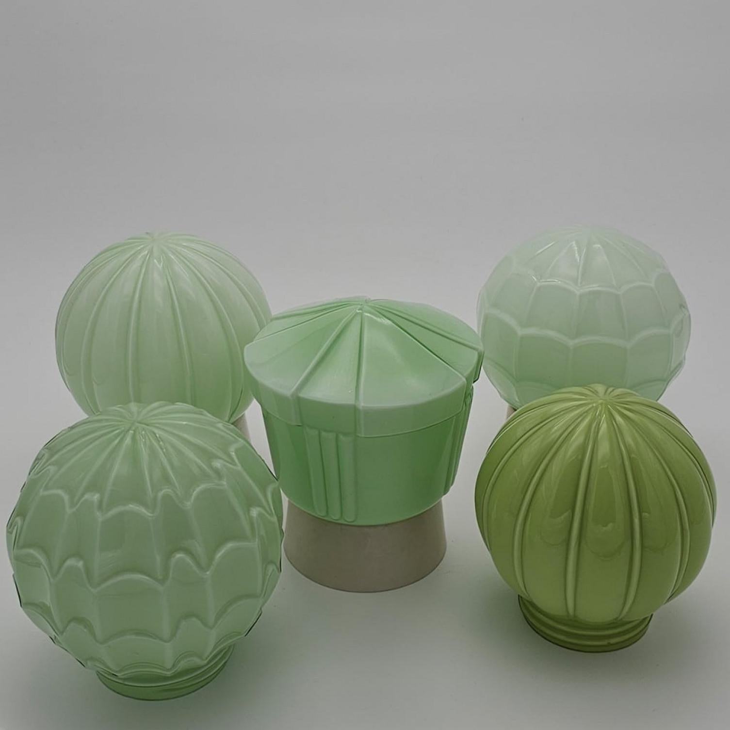Art Deco 1 of the 8 Green Pastel Colored Thabur lights, Bakelite Pressed Glass, 1930 For Sale