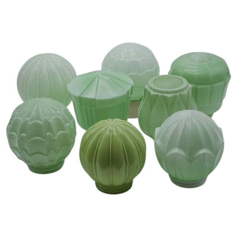 1 of the 8 Green Pastel Colored Thabur lights, Bakelite Pressed Glass, 1930 For Sale