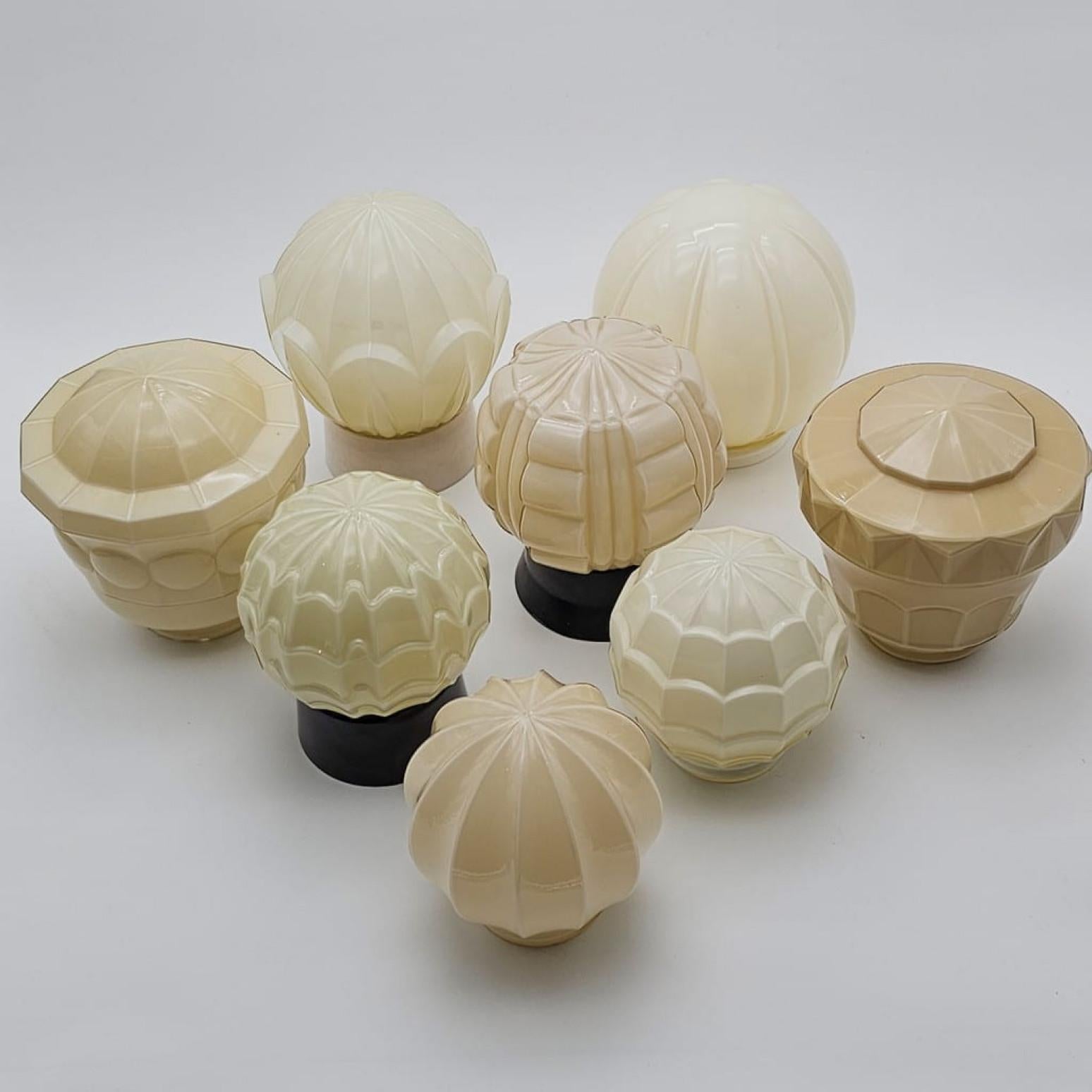 Beautiful pastel green Art Deco Thabur ceiling lamps. Dutch design from 1930. Made by the company Thabur in The Hague, Netherlands. Super cool various pastels with opaline glass and a bakelite fitting/base.

These Thabur lamps can be used as a