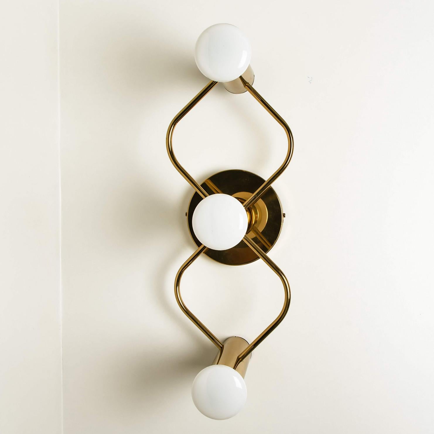 A gorgeous pair of Sciolari style ceiling or wall by Leola. Made with brass, Germany, 1970s.

Please notice the price is for the pair. several pairs available.

The light fixture requires 3 E14 candelabra bulbs, each up to 40 watts. Different
