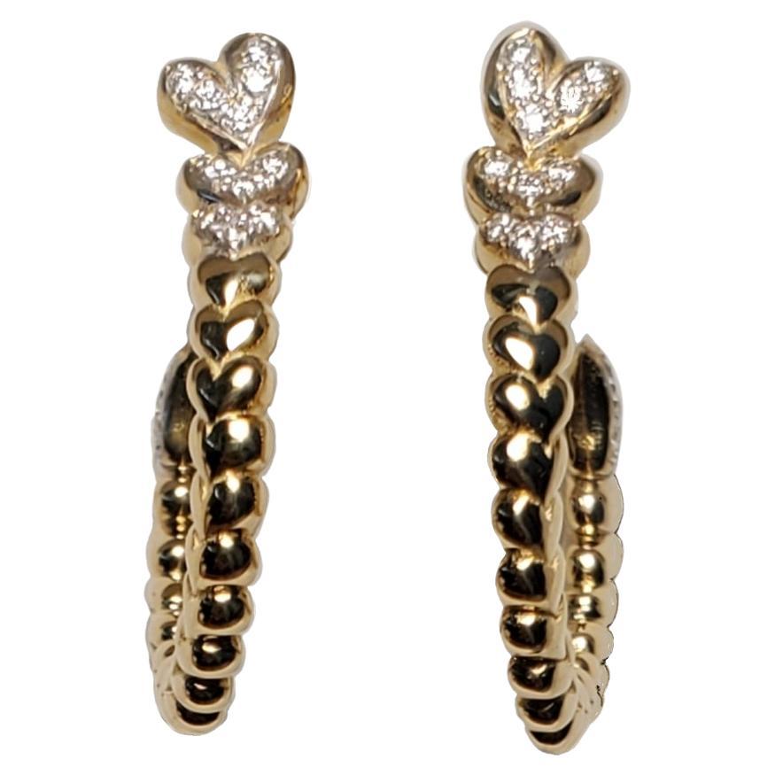 1 Pair Earrings 14k yellow gold Earrings with spiraling Diamonds Hearts 