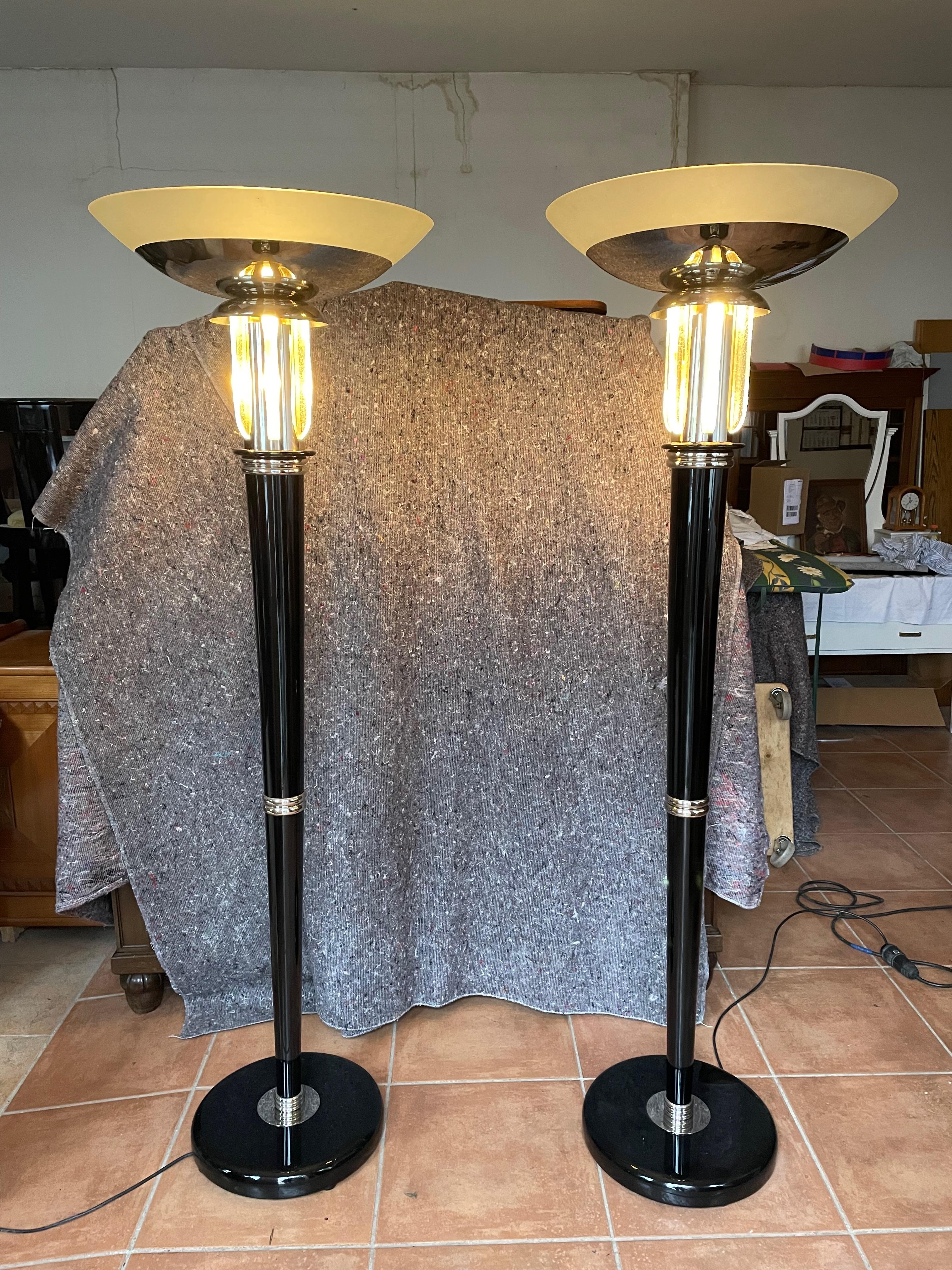 1 Pair of Spectacular very rare Art Déco floor lamps. France 1920s.
The Original lamps have been completely restored by a specialist.
High quality black piano lacquer.
New electrics.
Two bulbs inside each lamp. One bulb illuminates the wonderfl