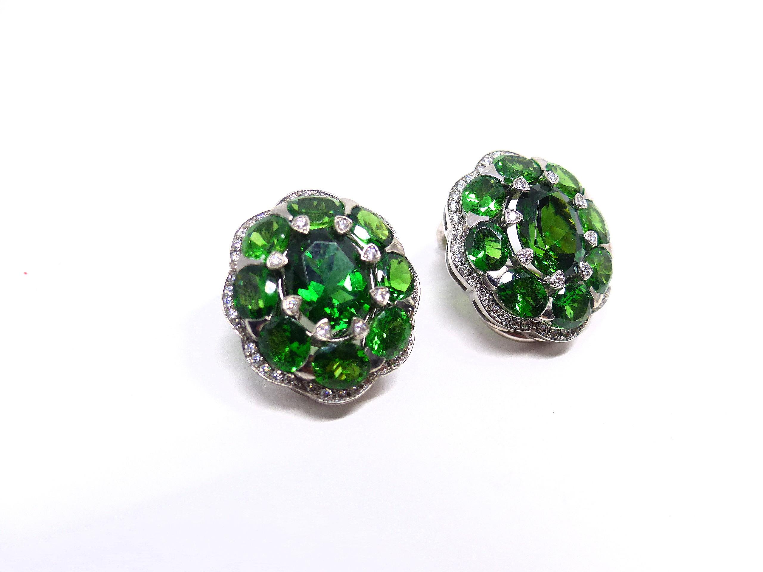 Thomas Leyser is renowned for his contemporary jewellery designs utilizing fine gemstones.

This 18k white gold (15.12g) pair of earrings is set with 2x fine Chrome-Tourmalines in intensiv green colour (oval, 9x7mm, 3.64ct) + 16x Tsavorites (oval,