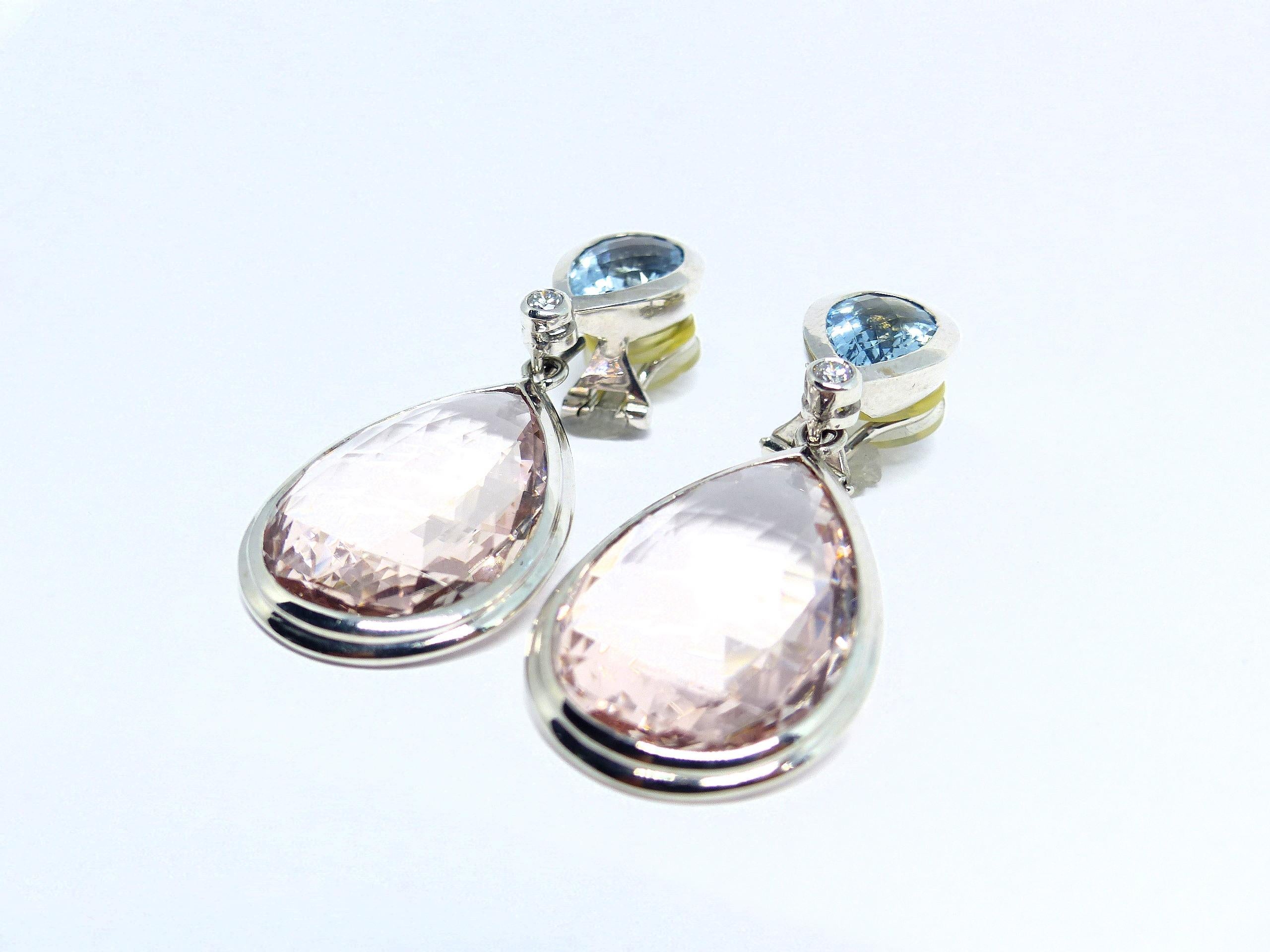 Thomas Leyser is renowned for his contemporary jewellery designs utilizing fine gemstones.

These 18k White Gold (25.96g) Pair of Earings are set with 2x fine Aquamarine (pear-shape, 12x8mm, 4,70ct) + 2x fine Morganite (briolette-cut, 25x17,5mm,