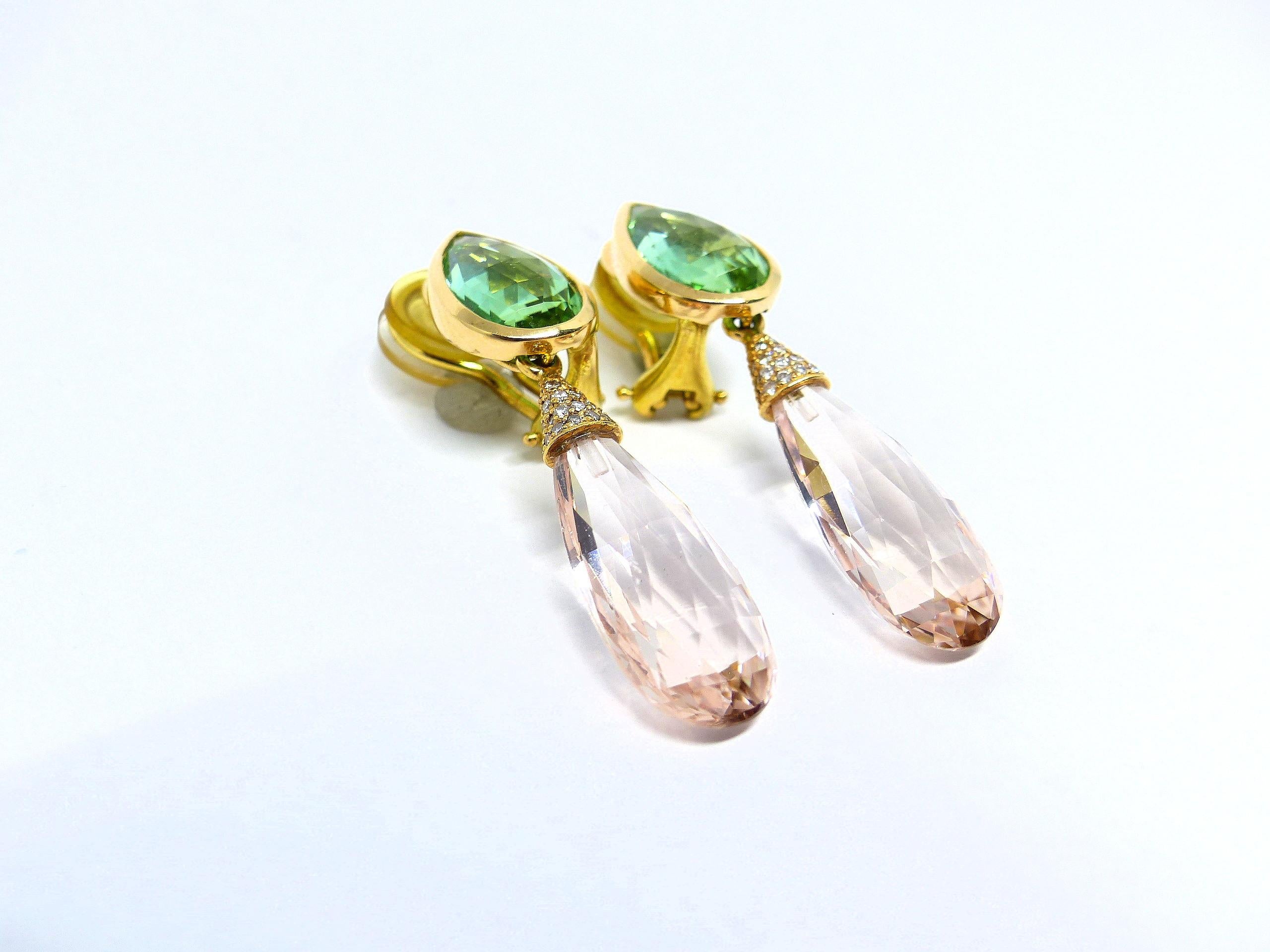 Thomas Leyser is renowned for his contemporary jewellery designs utilizing fine gemstones.

These 18k Rose Gold (12.30g) pair of earrings are set with 2x fine Morganites (briolette cut, 24x9.5x6.5mm, 16.29ct) + 2x fine Tourmalines (pear-shape,