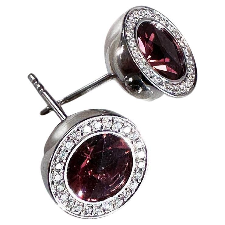 1 Pair Platinum Earrings with round Pink Tourmaline ø 8.0 mm and 50 brilliant cut diamonds F-vs with a total of 0.270ct
This earrings were handmade by Henrich & Denzel the platinum manufactory at Lake Constance in Germany. 
Henrich & Denzel stands