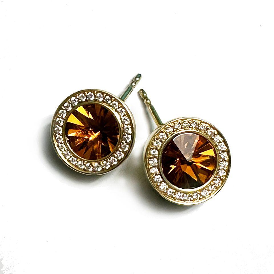 1 Pair Yellow Gold Earrings with a round Mandarin-Citrin ø 8.0 mm and 25 brilliant cut diamonds F-vs with a total of 0.125ct each earring. 
This earrings were handmade by Henrich & Denzel the platinum manufactory at Lake Constance in Germany.