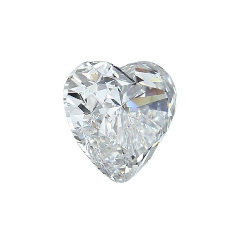 This diamond is a singular marvel, weighing a substantial 1.00 carats. Its unique Heart Brilliant shape adds a romantic and distinctive touch, making it a symbol of love and elegance. With a color grade of E, it boasts a near-colorless appearance,