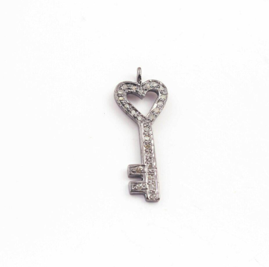 
1 Pc Pave Diamond Lock Key Charm Pendant 925 Sterling Silver Diamond Findings.

Size: 26x10 mm Approx.

Handmade
Yes

Country/Region of Manufacture
India

Style
Spacer Beads

Material
Sterling