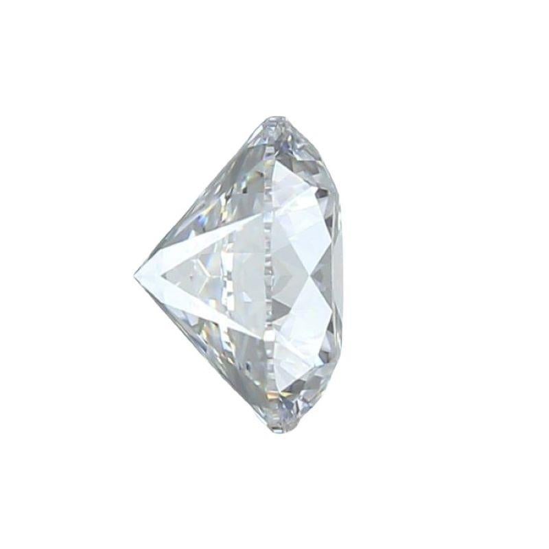 This stunning diamond is a single piece boasting a substantial carat weight of 0.90. Its Round Brilliant cut shape is meticulously crafted to maximize its brilliance and fire, creating a captivating display of light. With a color grade of D, it