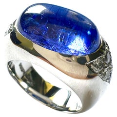 1 Ring in 950/Platin mit 1 Tansanit Cab. + 12 Diamanten Pavé