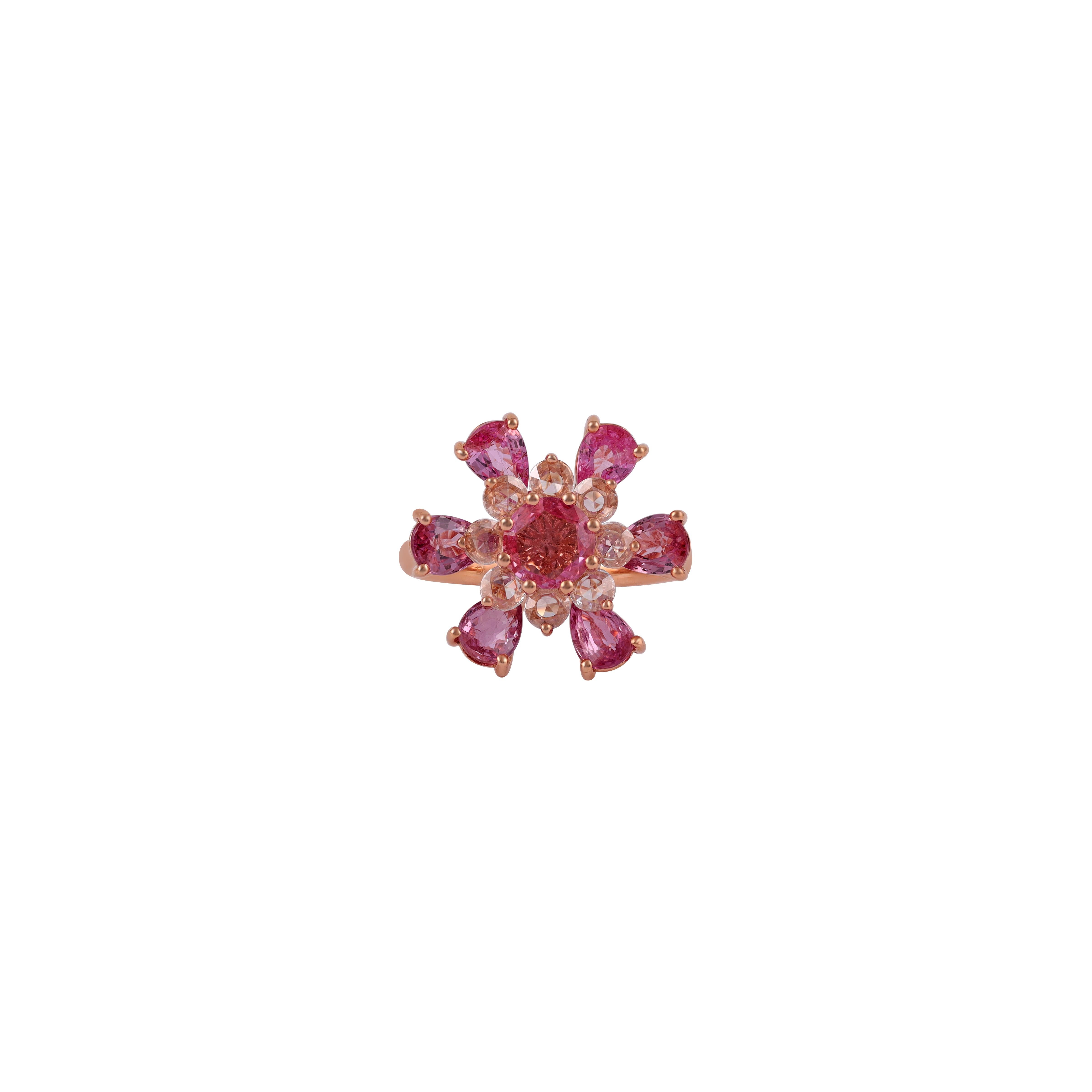 An exclusive 1 Round Pink Sapphire surrounded by 6 Pear shape Sapphire in 18 karat rose gold.
7 Pink Sapphire 3.50 CTS
8 Brilliant round cut Diamonds 0.41 CTS
18 k Rose gold mounting 5.42 GMS

Custom Services
Resizing is available.
Request