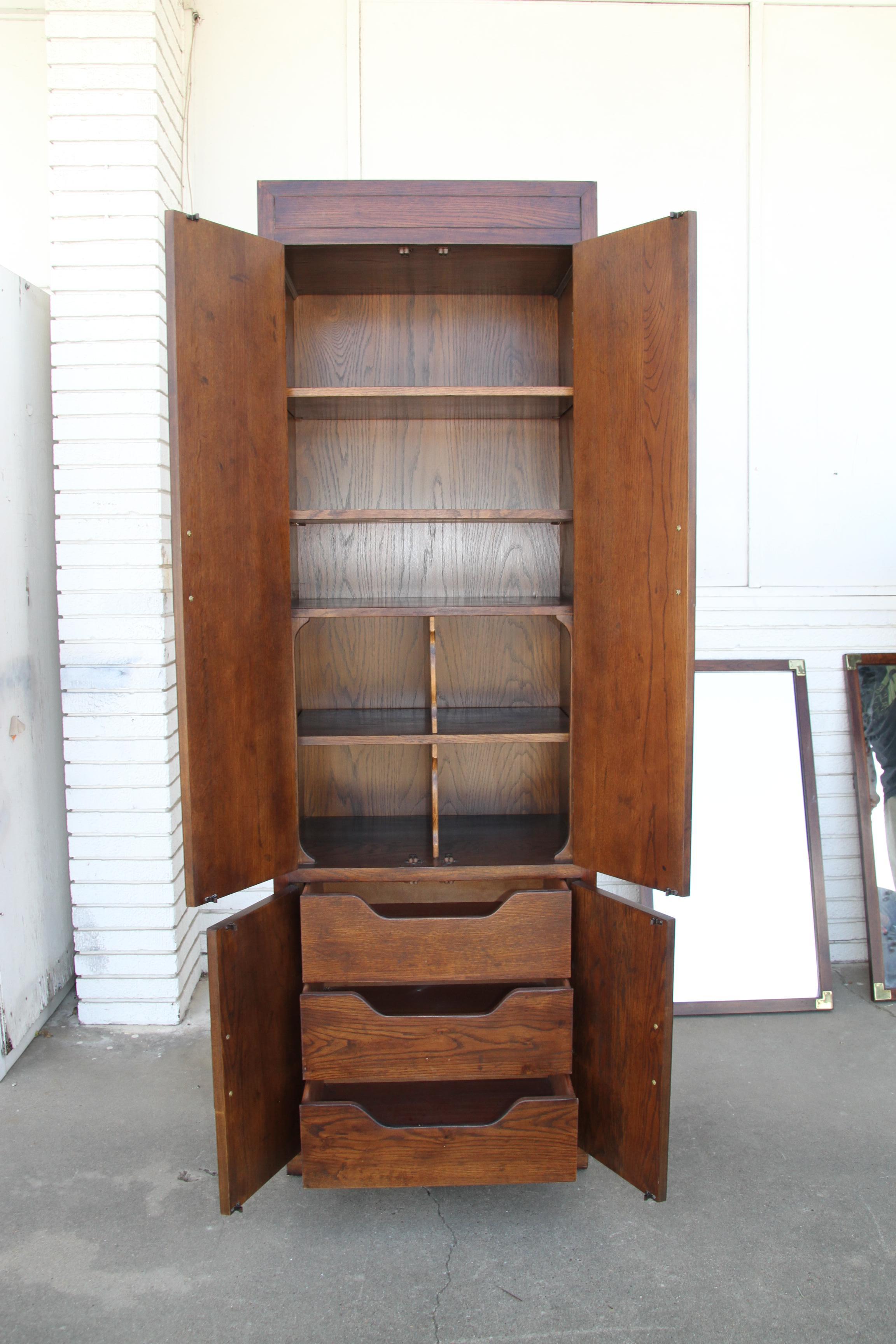 1 Scene One by Henredon Campaign armoire


Vintage campaign style armoire from the Scene One Collection by Henredon. Adjustable shelves, storage dividers, and 3 dovetailed drawers. Brass hardware. We have 3 available.

See bed and overhead