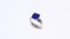 Ring in White Gold with 1 Tanzanite Asscher Cut and Diamonds.