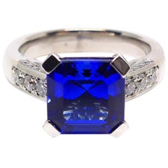 Ring in White Gold with 1 Tanzanite Asscher Cut and Diamonds.