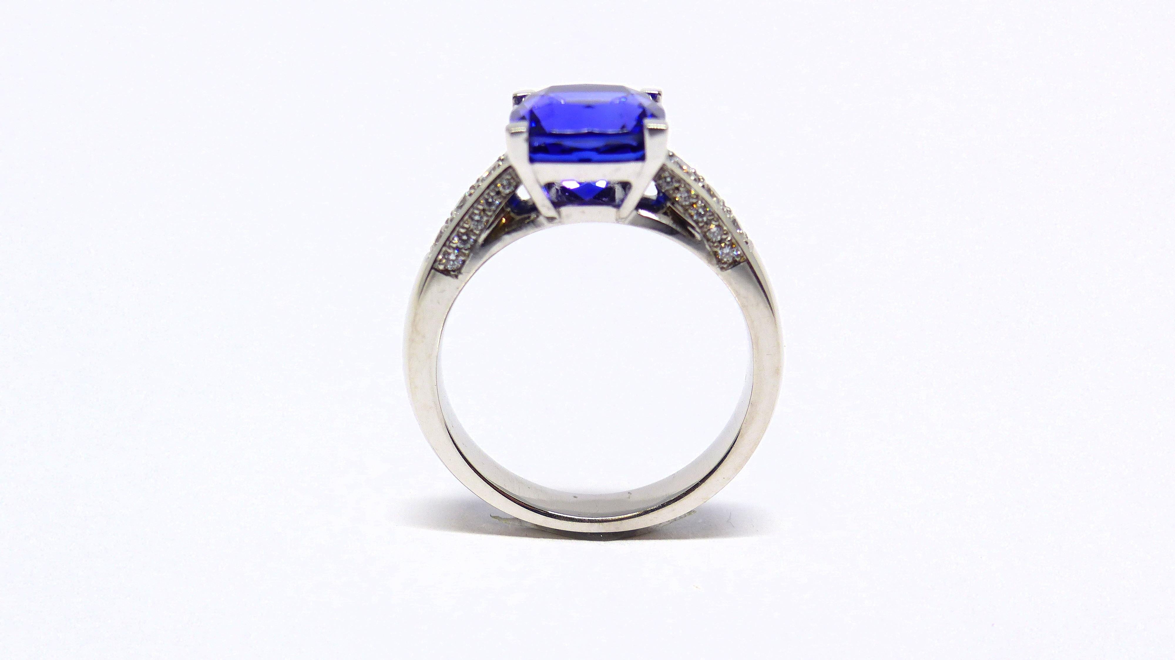 Contemporary Ring in White Gold with 1 Tanzanite Cushion shape and Diamonds. For Sale