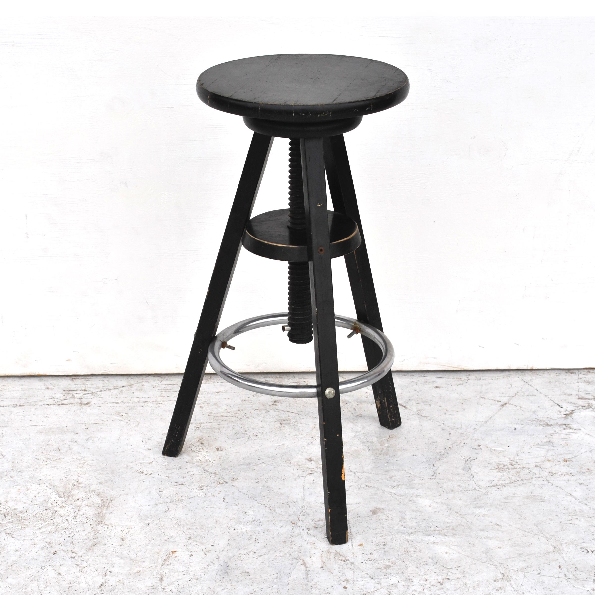Vintage industrial adjustable bar stool

Ebonized wood and metal construction 
Adjustable mechanism 25