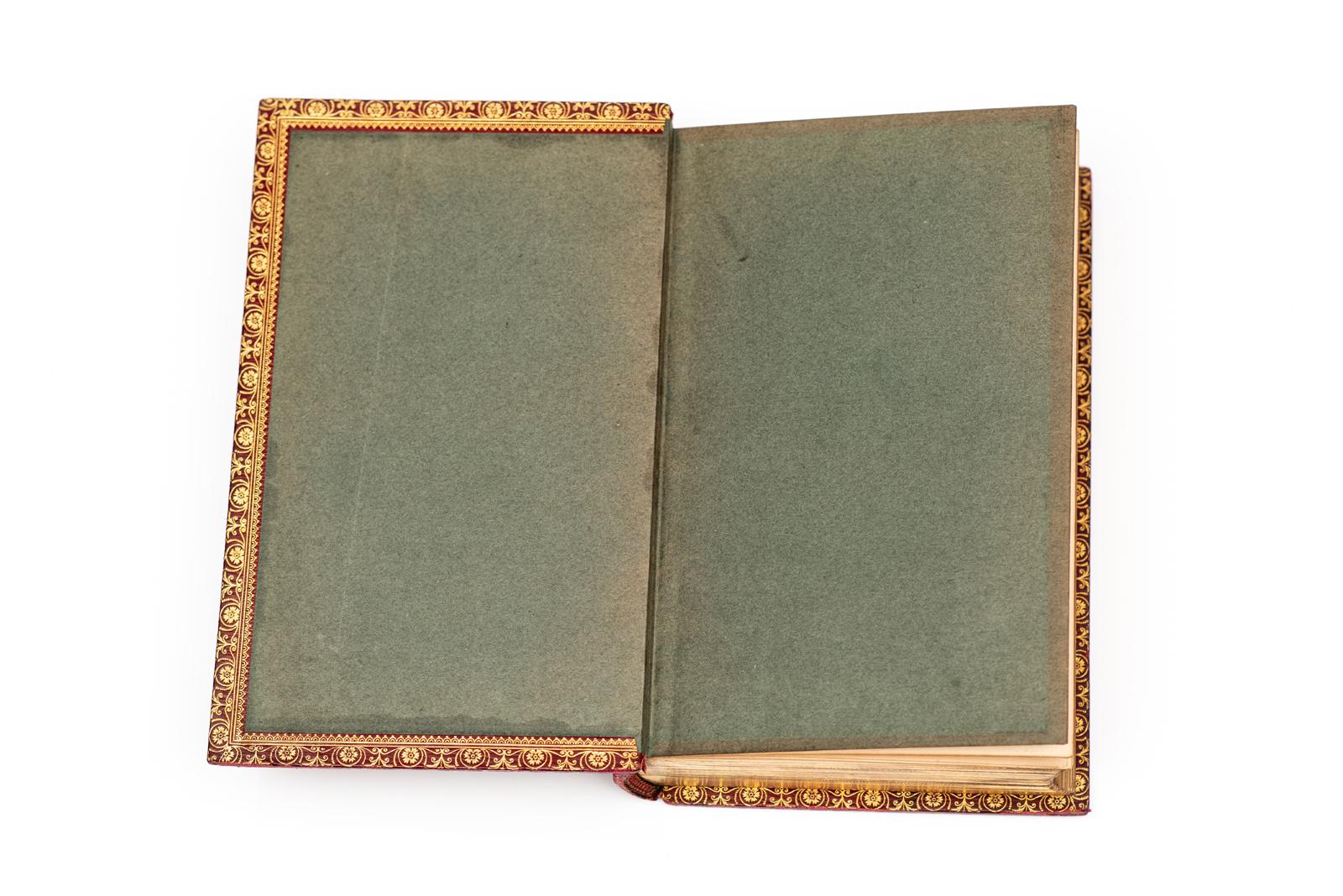 1 Vol. Charles Dickens, Our Mutual Friend. First Edition. Illustrated by Marcus Stone. Bound in full red Morocco. All edges gilt. Gilt borders on interior and exterior covers. Ornate gilt panels on spine. Raised bands. Published London: Chapman and