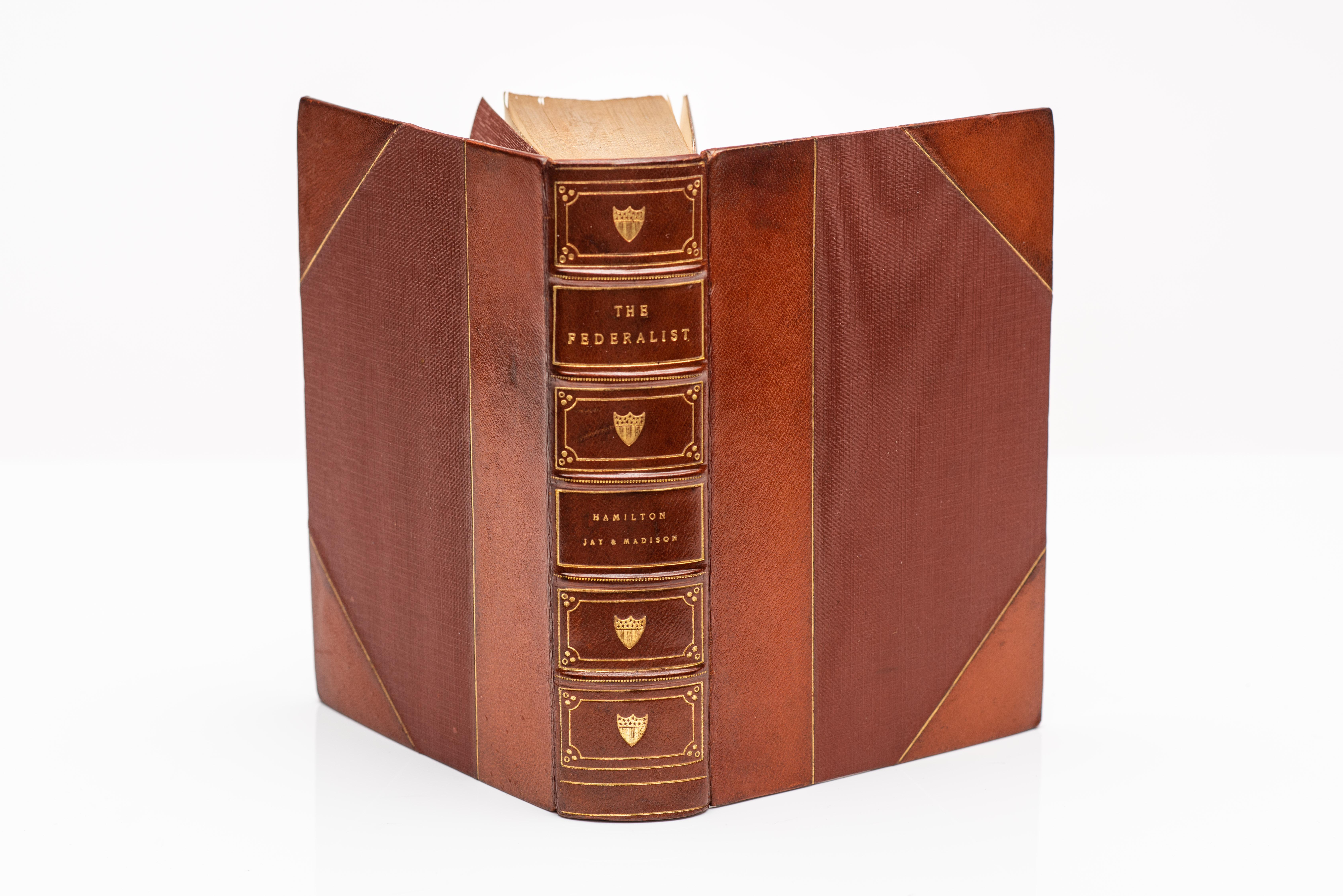 1 Volume. Alexander Hamilton, John Jay & James Madison. The Federalist. Edited by Henry Cabot Lodge. Bound in 3/4 tan morocco, linen boards, top edges gilt, raised bands, gilt panels. Published: New York & London: G.P. Putnam's Sons, 1888.