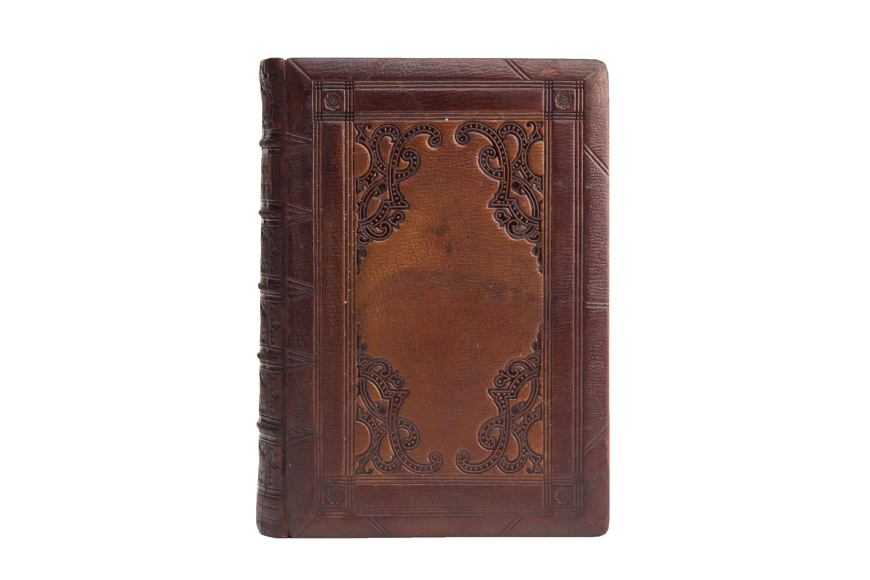 1 Volume. (Anon) The Book of Common Prayer. First Edition. Bound in full brown morocco with covers displaying ornate and geometric black tooling. Raised band spined with ornate black-tooled panels and label lettering in gilt. All of the edges are
