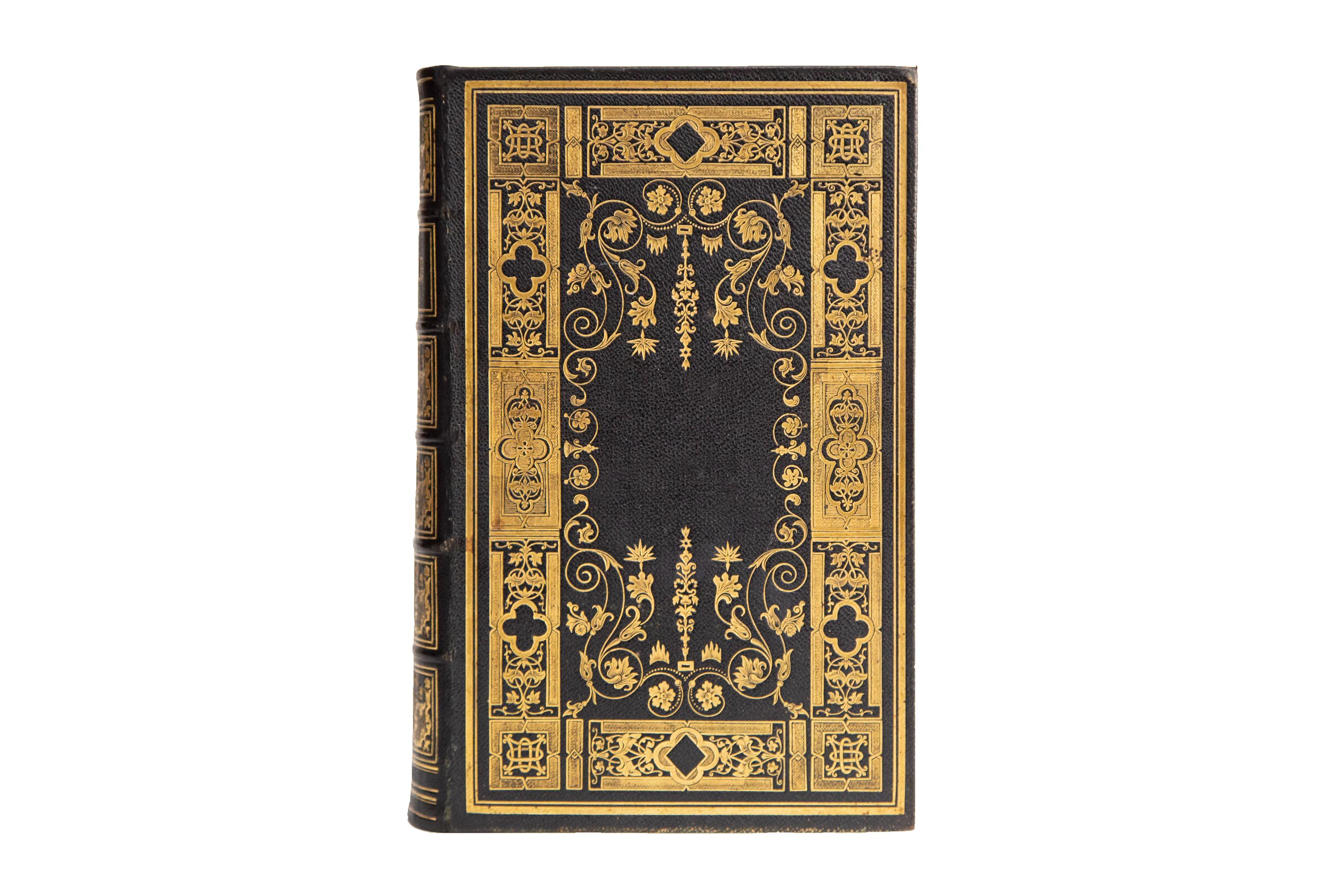 1 Volume. (Anon) The Holy Bible. Bound in full black morocco with covers displaying incredibly intricate gilt tooling with many floral designs and ornate bordering details. Raised bands with similarly ornate panel details and label lettering in gilt