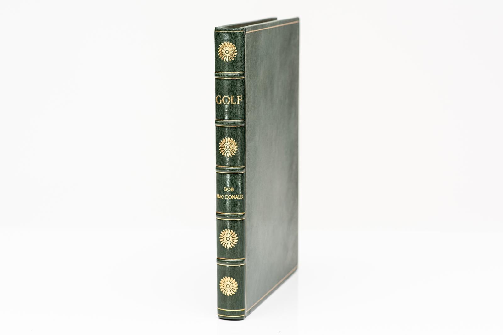 1 Volume. Bob MacDonald. Golf. Illustrated, rebound in full green morocco, all edges gilt, raised bands, gilt panels, marbled endpapers. Published: Chicago; The Wallace Press; 1927
First Edition
H:11