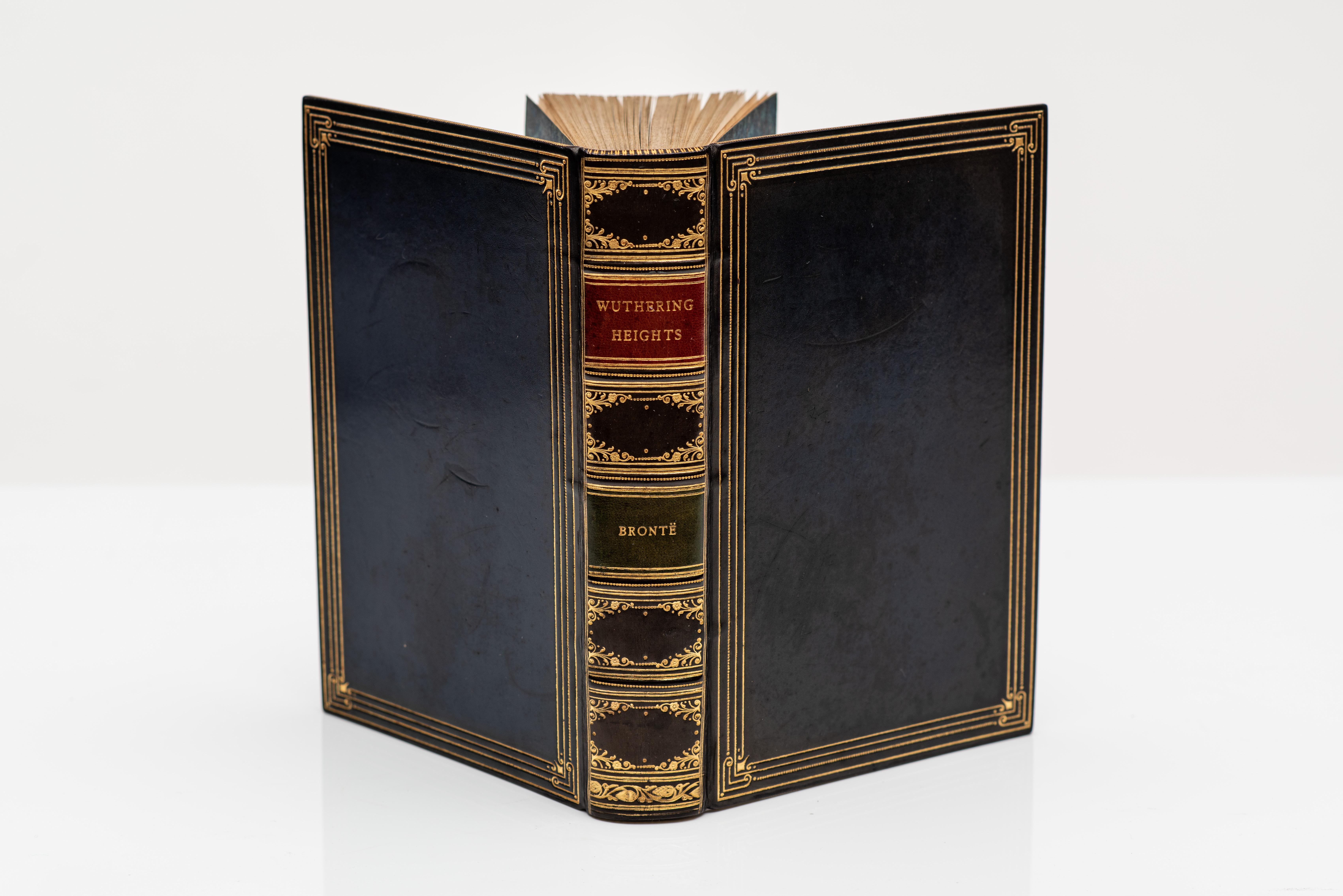 1 Volume. Bronte, Emily. Wuthering Heights. With 16 coloured illustrations by Percy Tarrant. Bound in full blue calf by Riviere, all edges gilt, raised bands, ornate gilt on spine, marbled endpapers. Published: London: George G. Harrap & Co. 1924