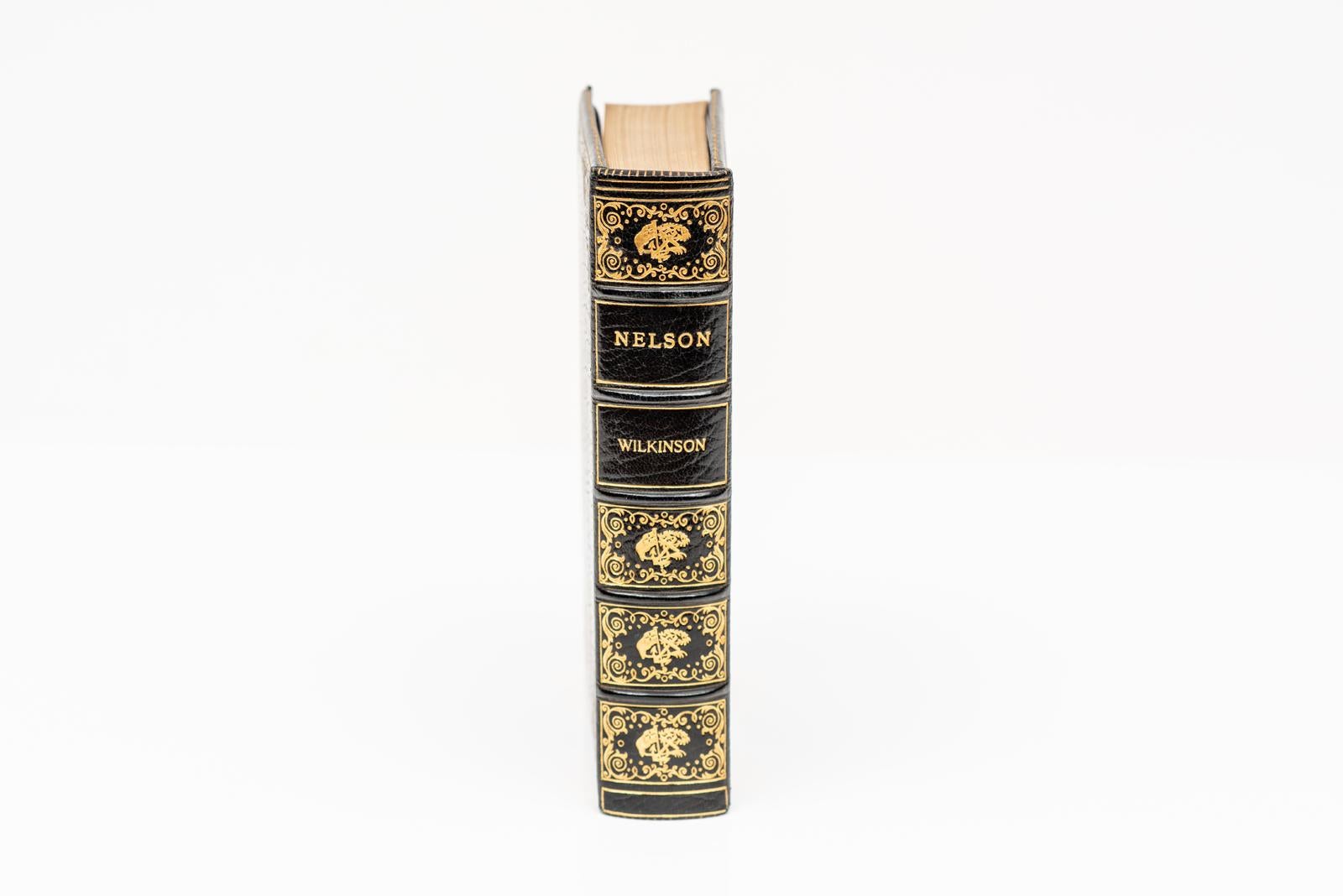 1 Volume. C. Wilkinson, Nelson. Bound by Bayntun in full blue morocco with an oval miniature of Lord Nelson on the front cover. Cosway style binding. Ornate gilt-tooling on the covers and raised band spine. All edges gilt. Silk doublures. London: