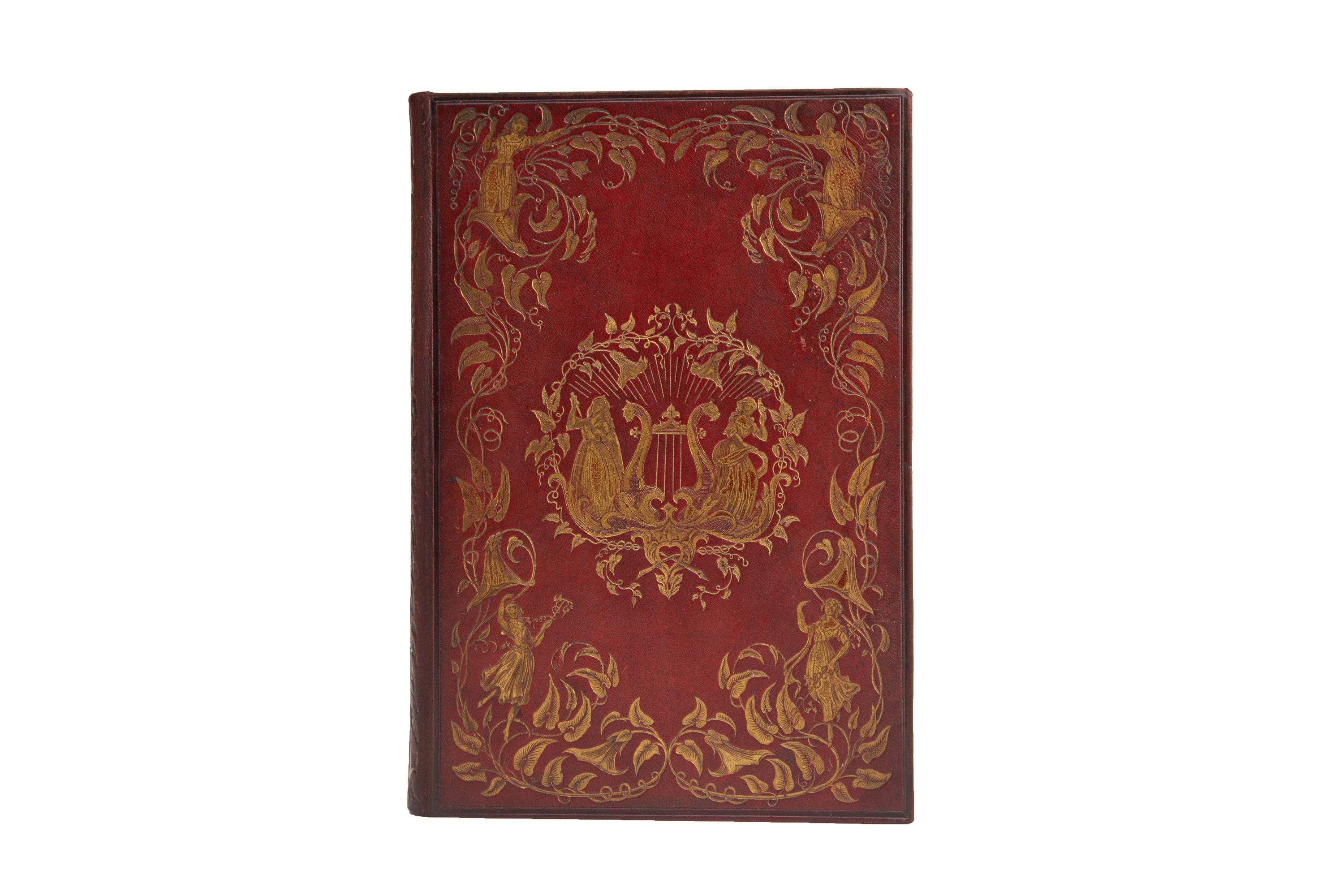 1 Volume. Charles Heath, Beauties of the Opera and Ballet. Bound in full red morocco with covers displaying ornate and expansive gilt-tooled detailing depicting dramatic figures and floral vines. The spine displays gilt detailing similar to the