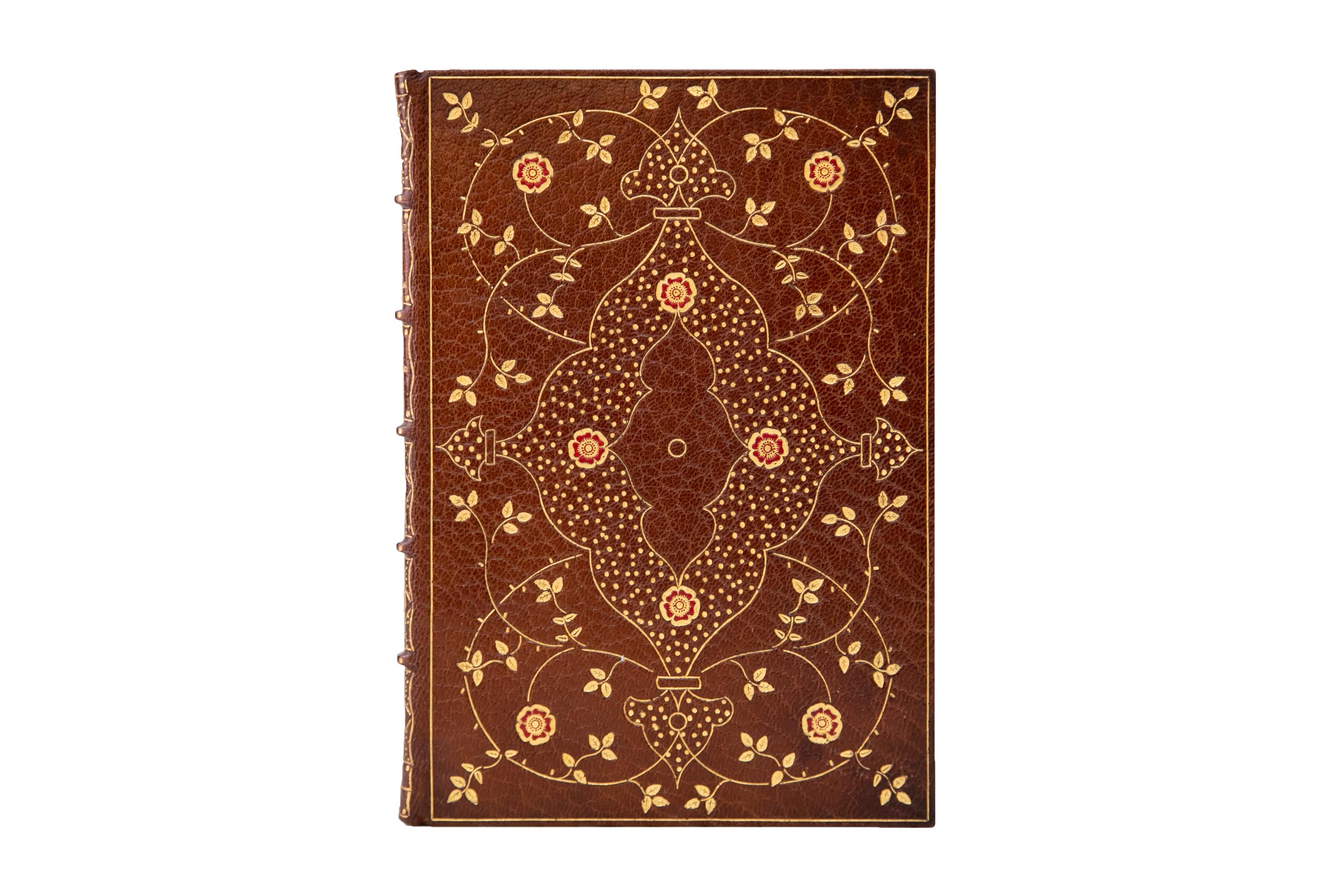 1 Volume. Edward Fitzgerald, Rubáiyát of Omar Khayyám. Bound in full brown morocco with the cover displaying floral gilt-tooled detailing with red inlay. The spines display raised bands, floral panel details, and label lettering, all gilt-tooled