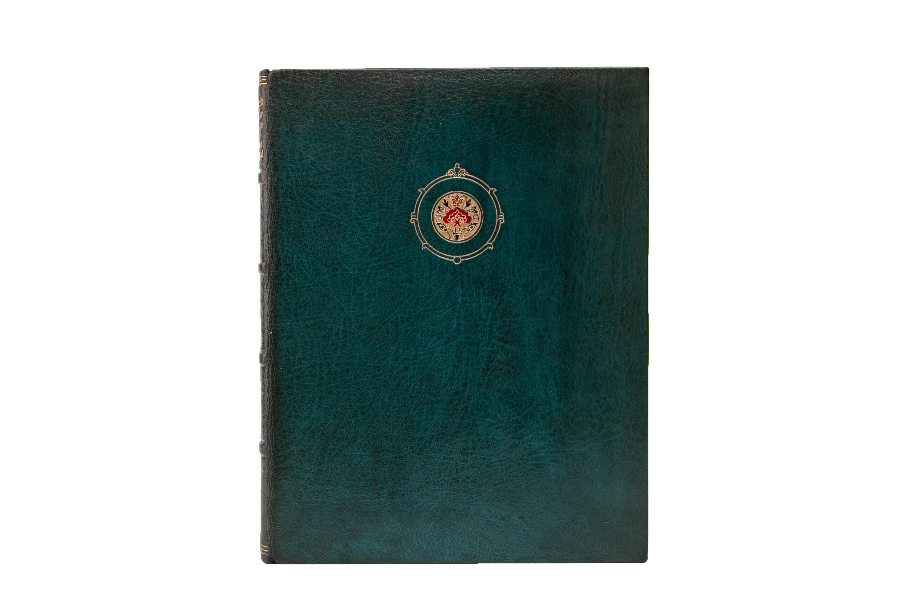 1 Volume. Edward Fitzgerald, Rubáiyát of Omar Khayyám. Bound in full blue morocco with the cover displaying a central floral crest in gilt-tooling and multi-color inlay. The spine displays raised bands and gilt-tooled label lettering. The top edge