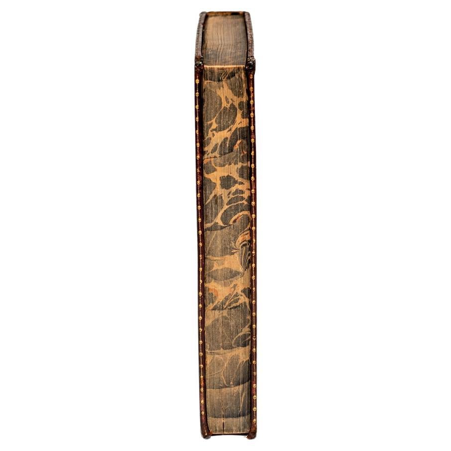 1 Volume. George Cruikshank, Omnibus. First Edition. Bound in 3/4 black morocco with marbled boards. Cover and raised band spine are gilt-tooled. Marbled endpapers. Illustrated with 100 engravings on steel and wood. London: Tilt & Bogue, 1842. 