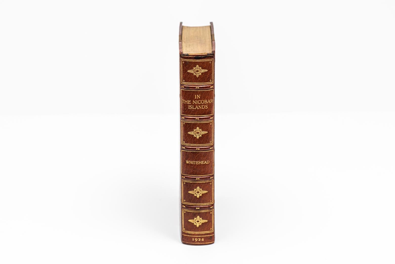 1 Volume. George Whitehead, In the Nicobar Islands. First Edition. Bound by Bayntun in 3/4 brown morocco and linen boards. The covers and raised band spine are gilt-tooled. The top edge is gilt with marbled endpapers. Includes a preface by Sir