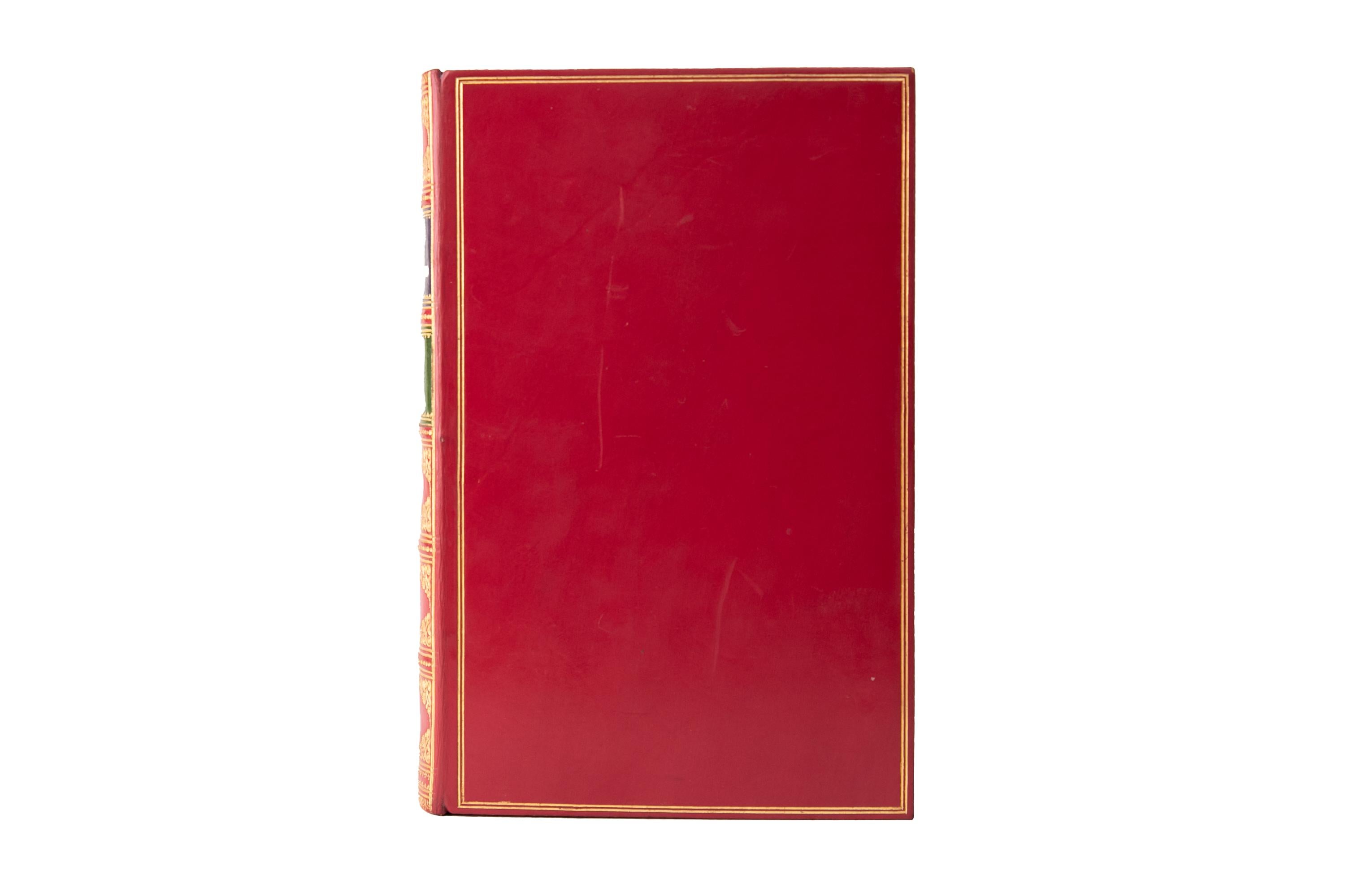 1 Volume. Gilbert Abbott A. Beckett, The Comic History of England. First Edition. Bound by Bayntun in full red calf. The covers and raised band spine are gilt-tooled with green and purple morocco labels. All edges are gilt with gilt-tooled dentelles