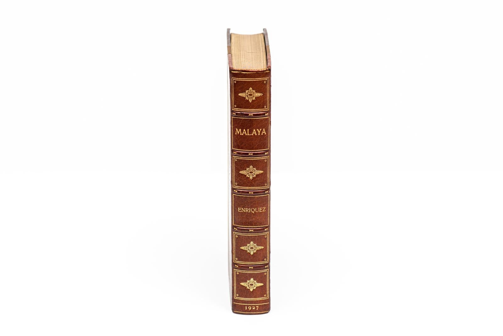1 Volume. Major C.M. Enriquez, Malaya. First Edition. Bound by Bayntun in 3/4 brown morocco and linen boards. The covers and raised band spines are gilt-tooled. the top edge is gilt with marbled endpapers. London: Hurst & Blackett, Ltd., 1927.