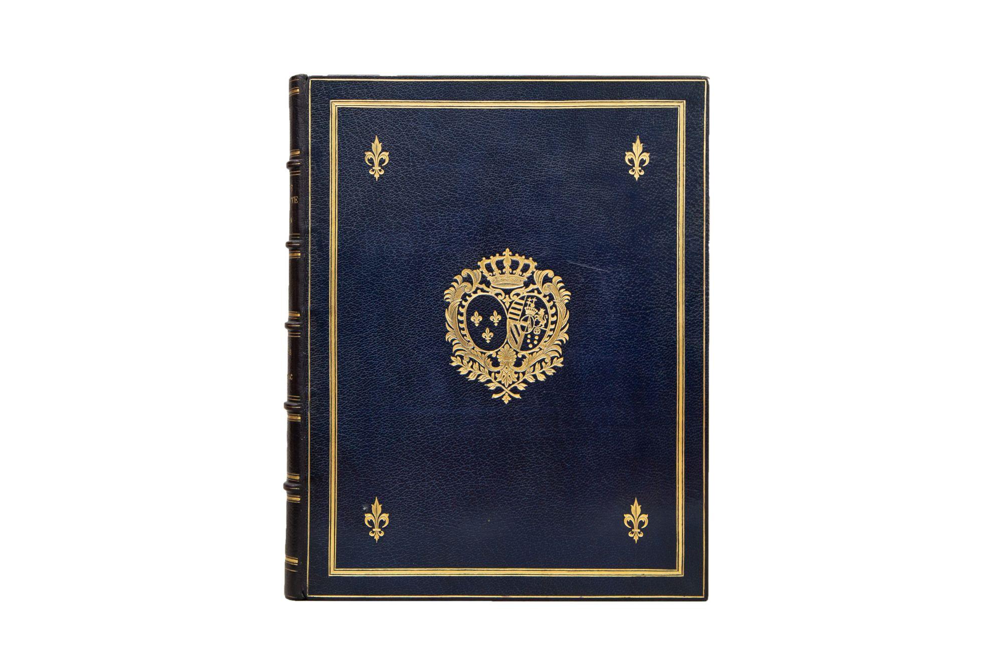 1 Volume. Pierre de Nolhac, Marie Antoinette, The Queen. Bound in full navy morocco with covers displaying a crest, Fleur de Lis details, and borders in gilt. Raised band spine with panels displaying gilt Fleurs de Lis and titles. Top edge gilt with