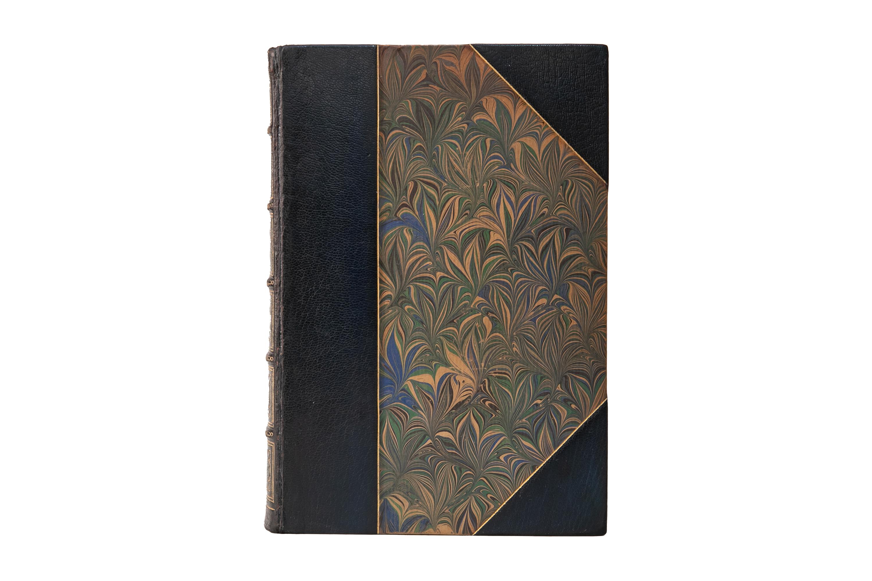 1 Volume. Plato, The Works. Bound by Bayntun in 2.4 blue morocco and marbled boards, bordered in gilt-tooling. The spines display raised bands, bordering, and label lettering, all gilt-tooled. The top edge is gilded with marbled endpapers.